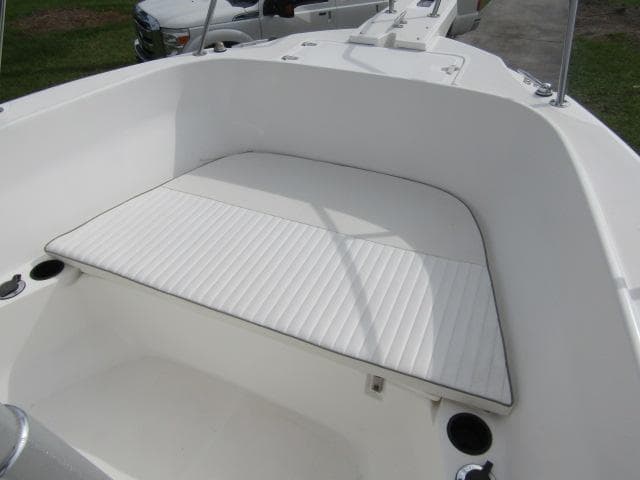 1999 Boston Whaler 23 Outrage boat interior with cushioned seating area.