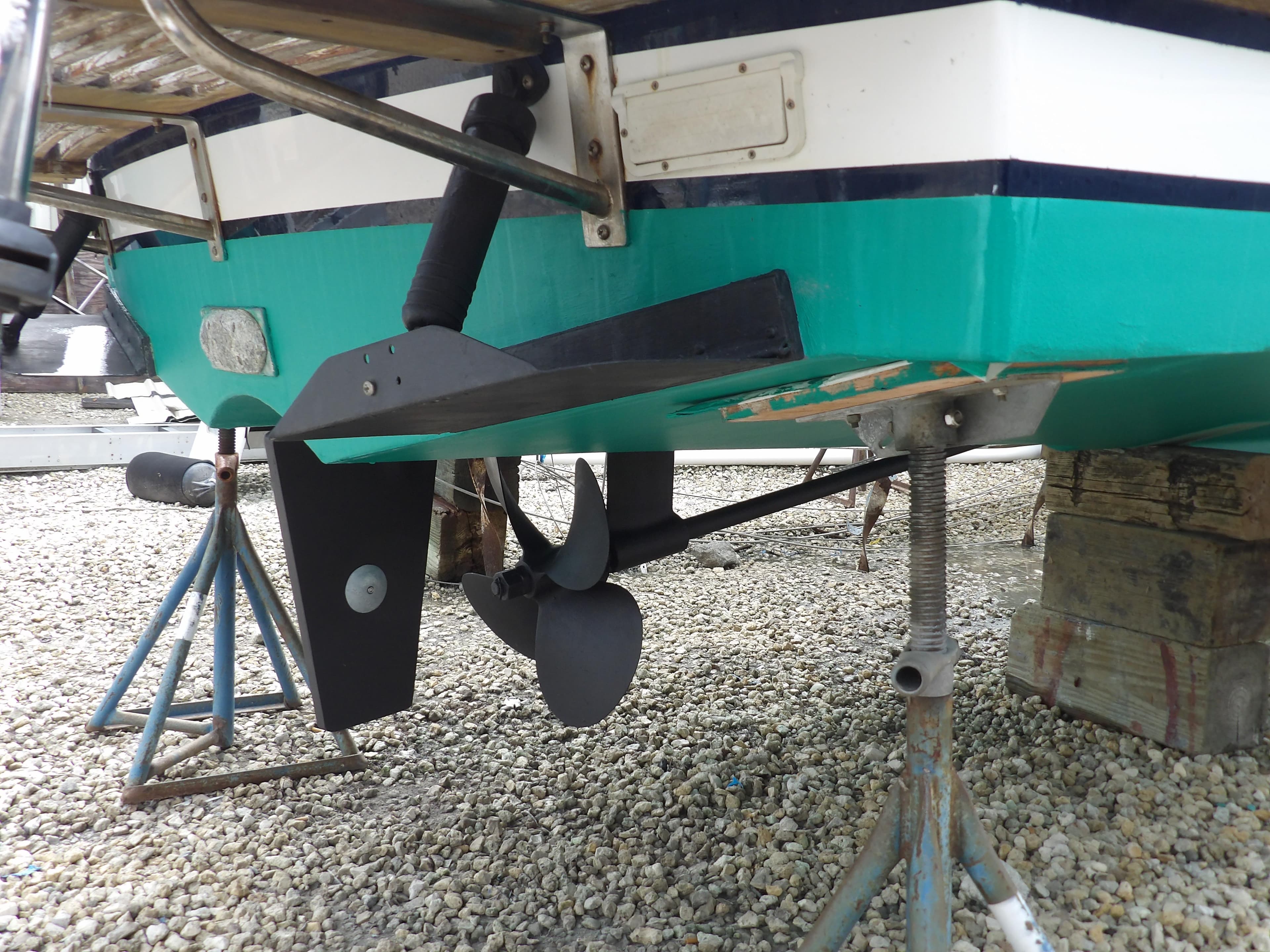 2002 Legacy Yachts 28 Express boat hull and propeller on stands.