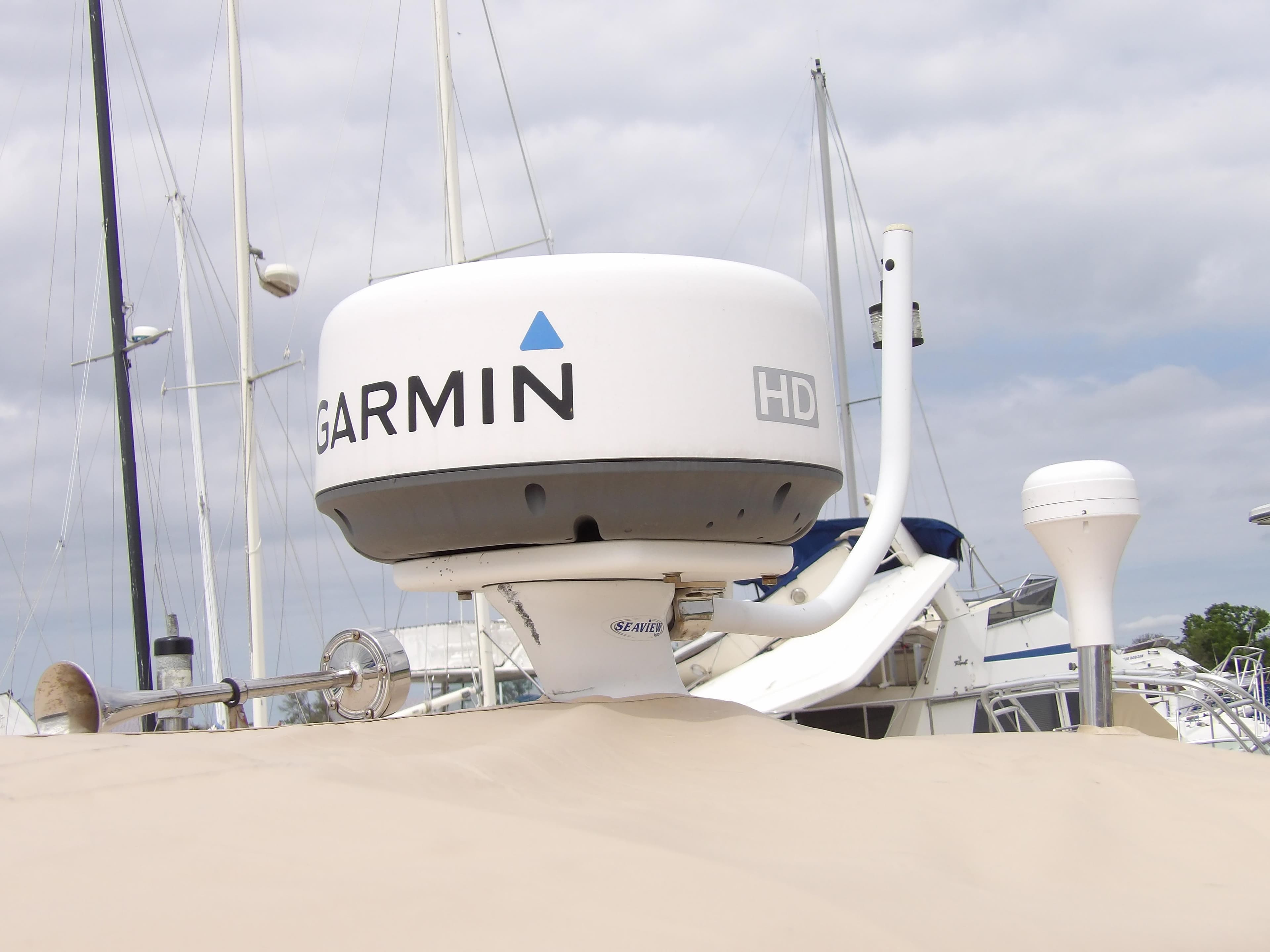 Garmin radar on 2002 Legacy Yachts 28 Express, docked with other boats in background.
