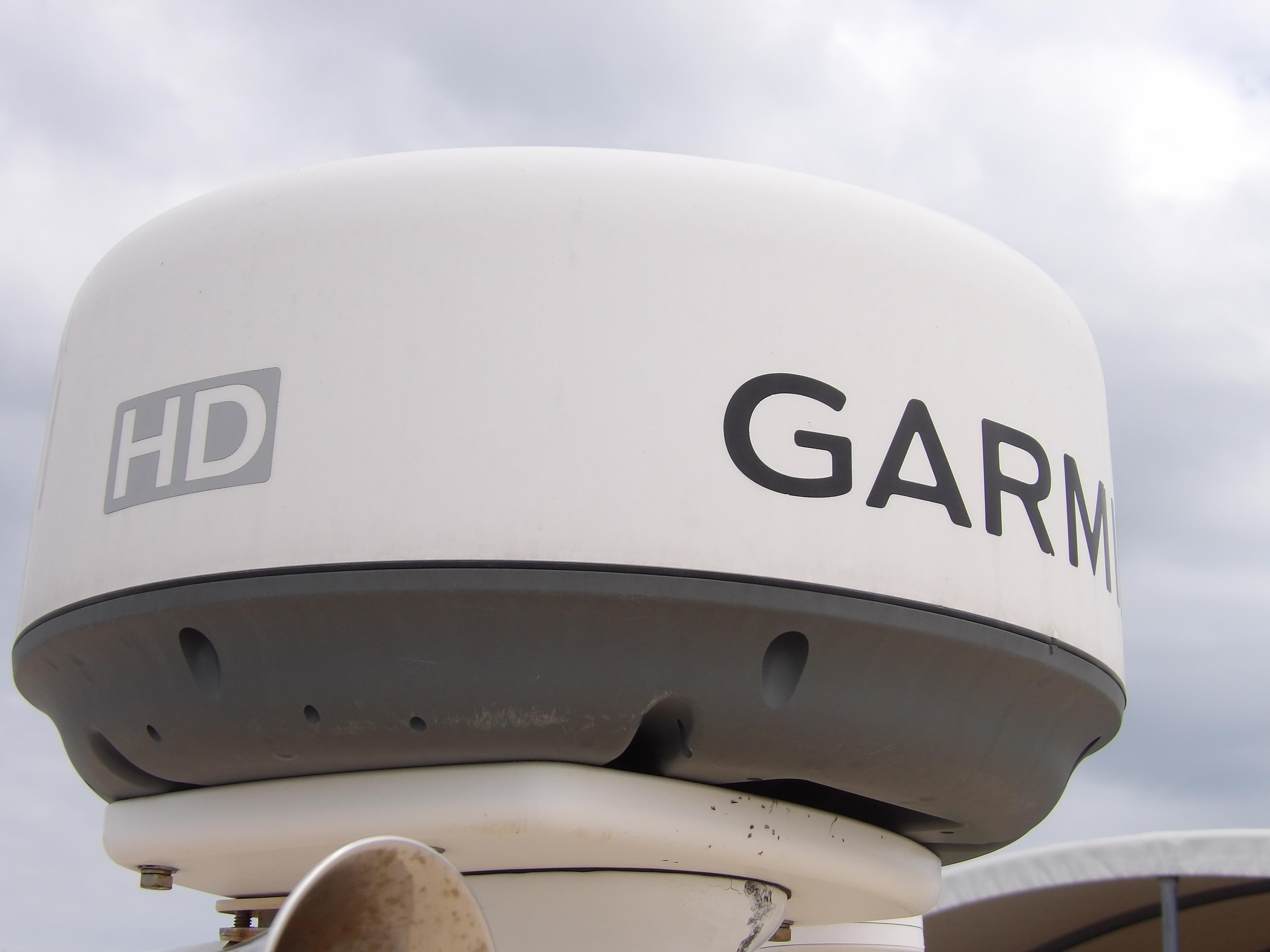 Garmin HD radar on 2002 Legacy Yachts 28 Express under cloudy sky.