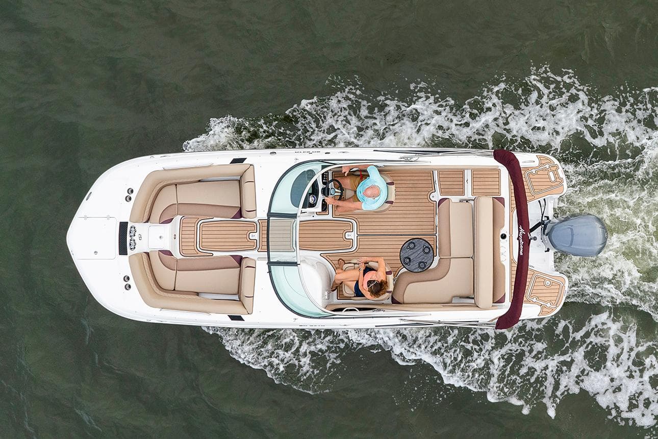 Manufacturer Provided Image: Aerial view of 2021 Hurricane SunDeck 2410 OB boat cruising on water.