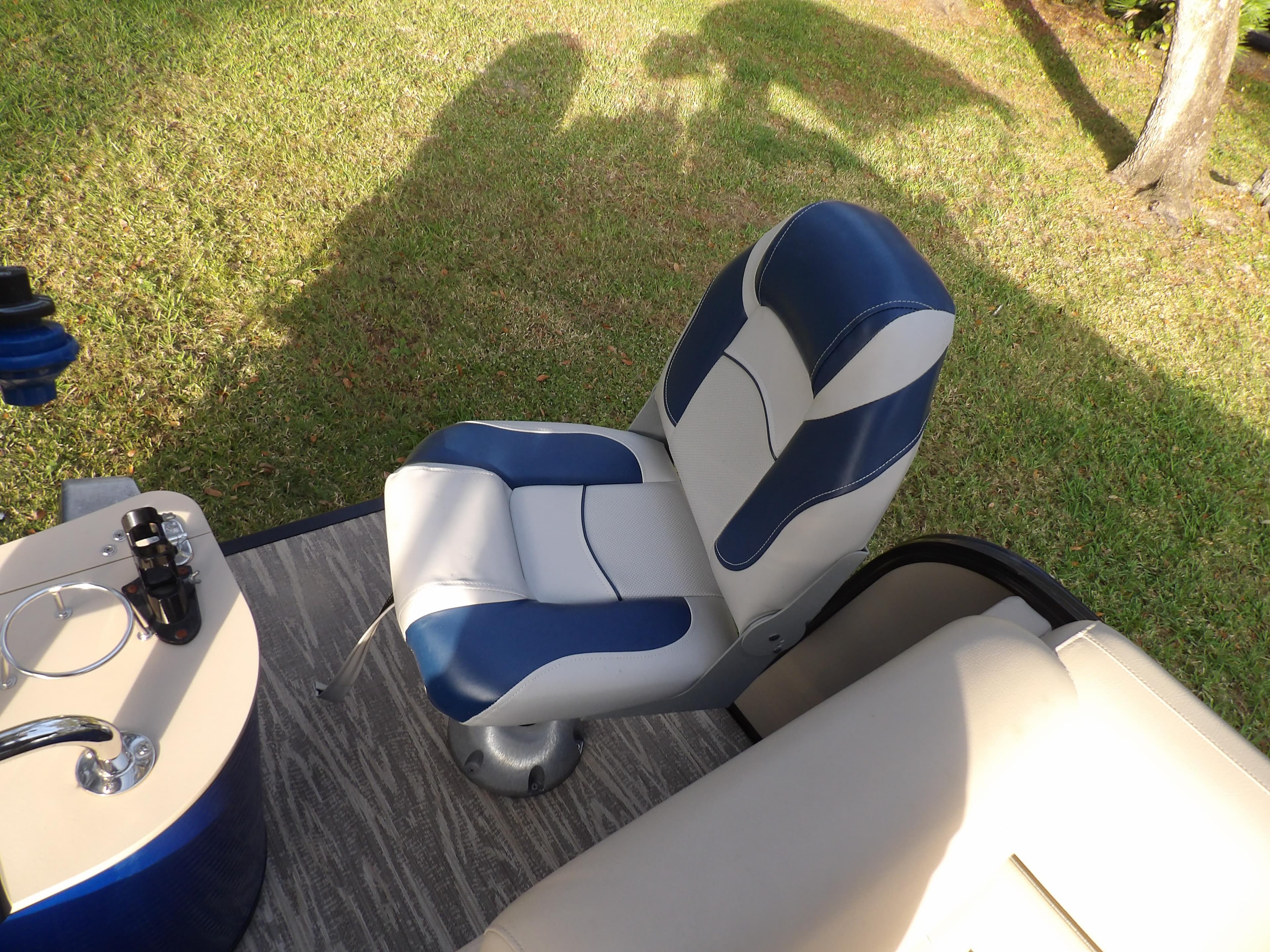 2020 Avalon 2385 Catalina QL SWS boat seat and console on grassy background.