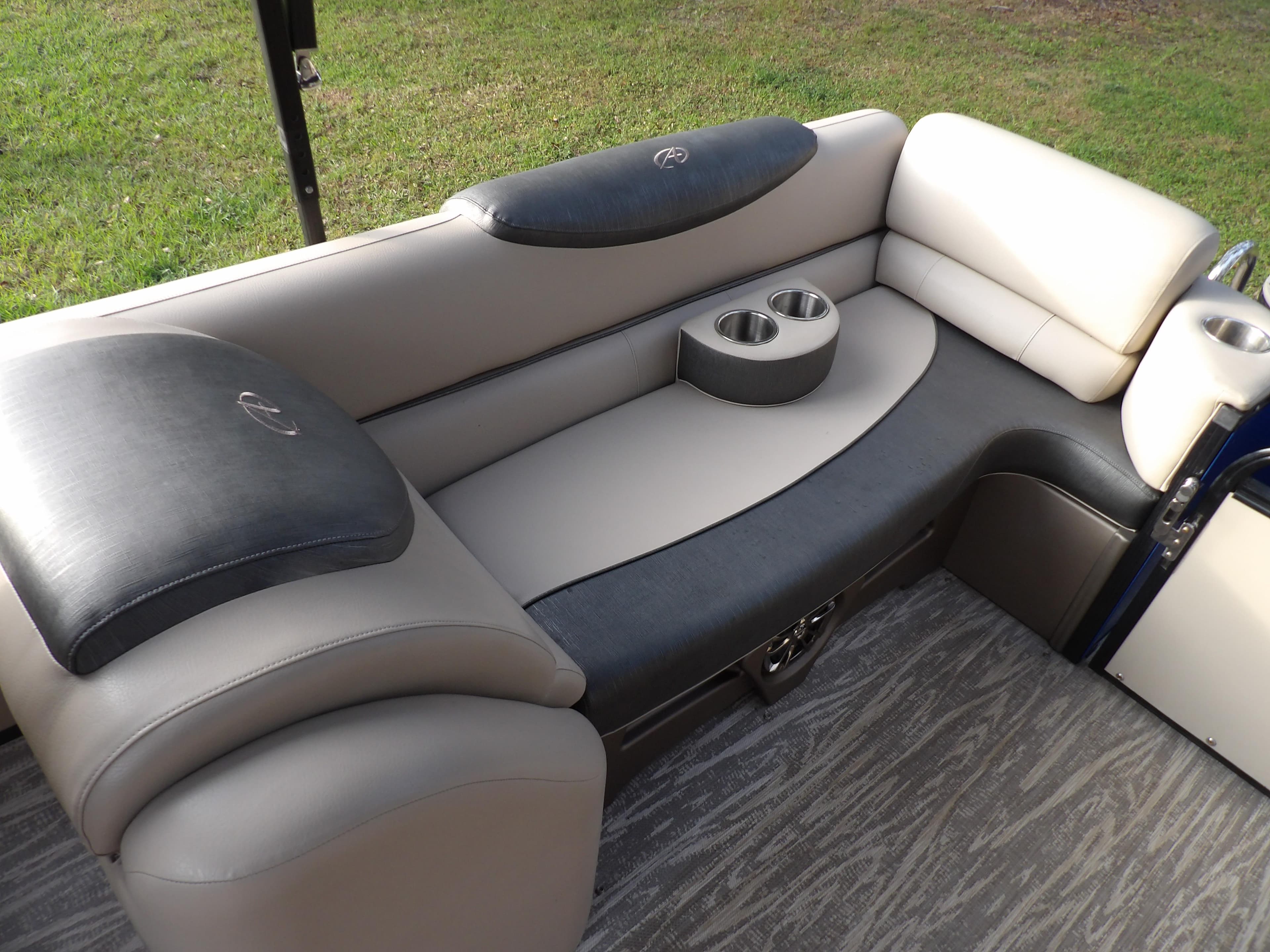 2020 Avalon 2385 Catalina QL SWS boat interior seating with cup holders.