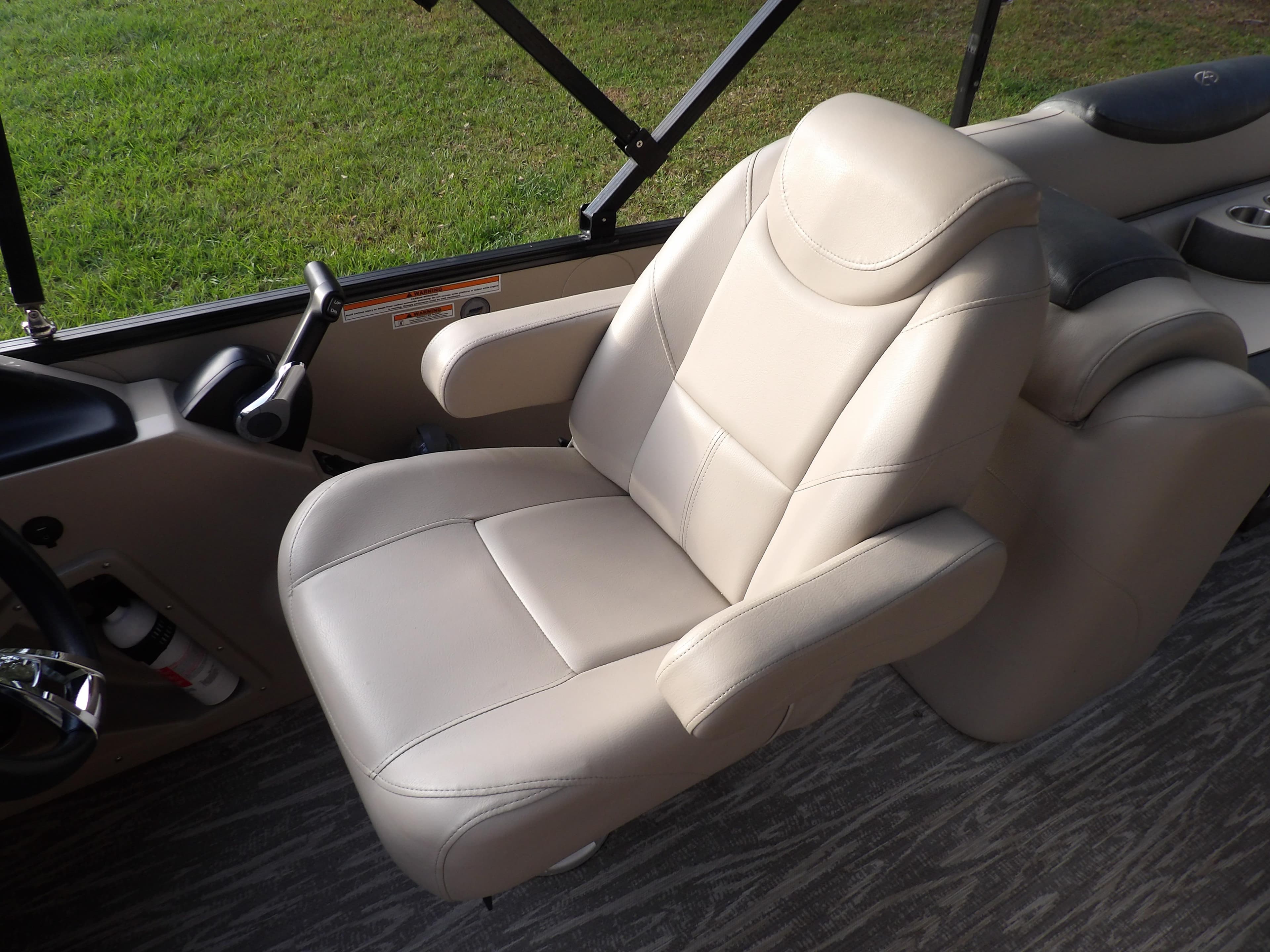 2020 Avalon 2385 Catalina QL SWS boat captain's chair with beige upholstery.