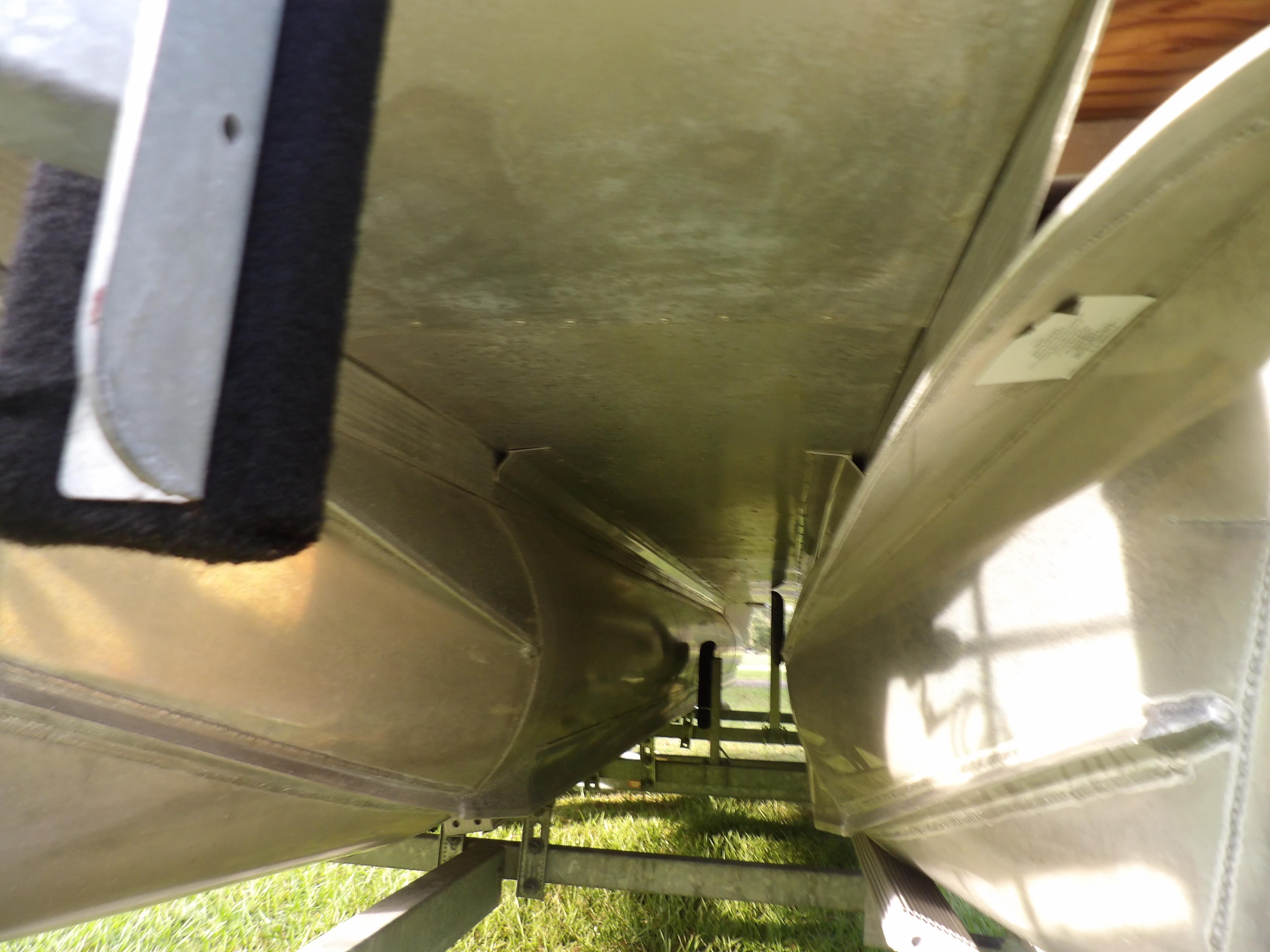 Underneath view of 2020 Avalon 2385 Catalina QL SWS pontoon boat on trailer.