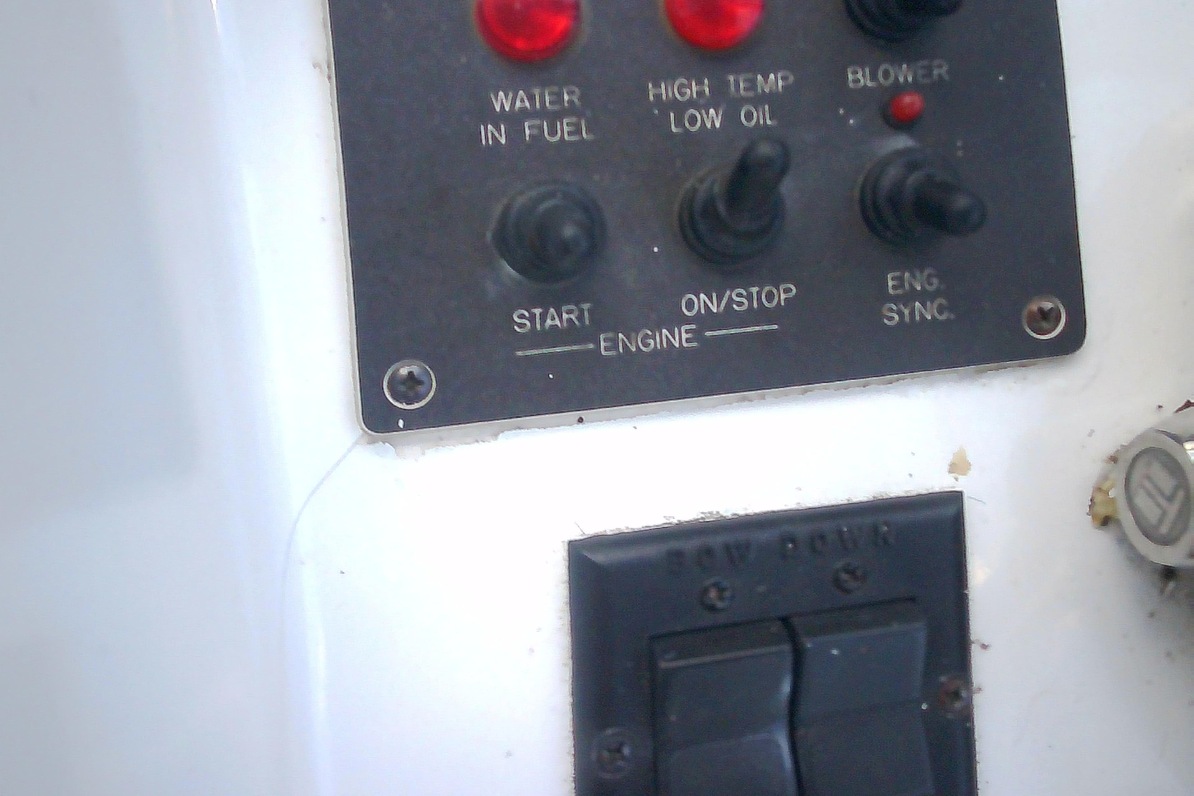 Control panel of a 1999 Sabre 34 boat with switches and indicators.
