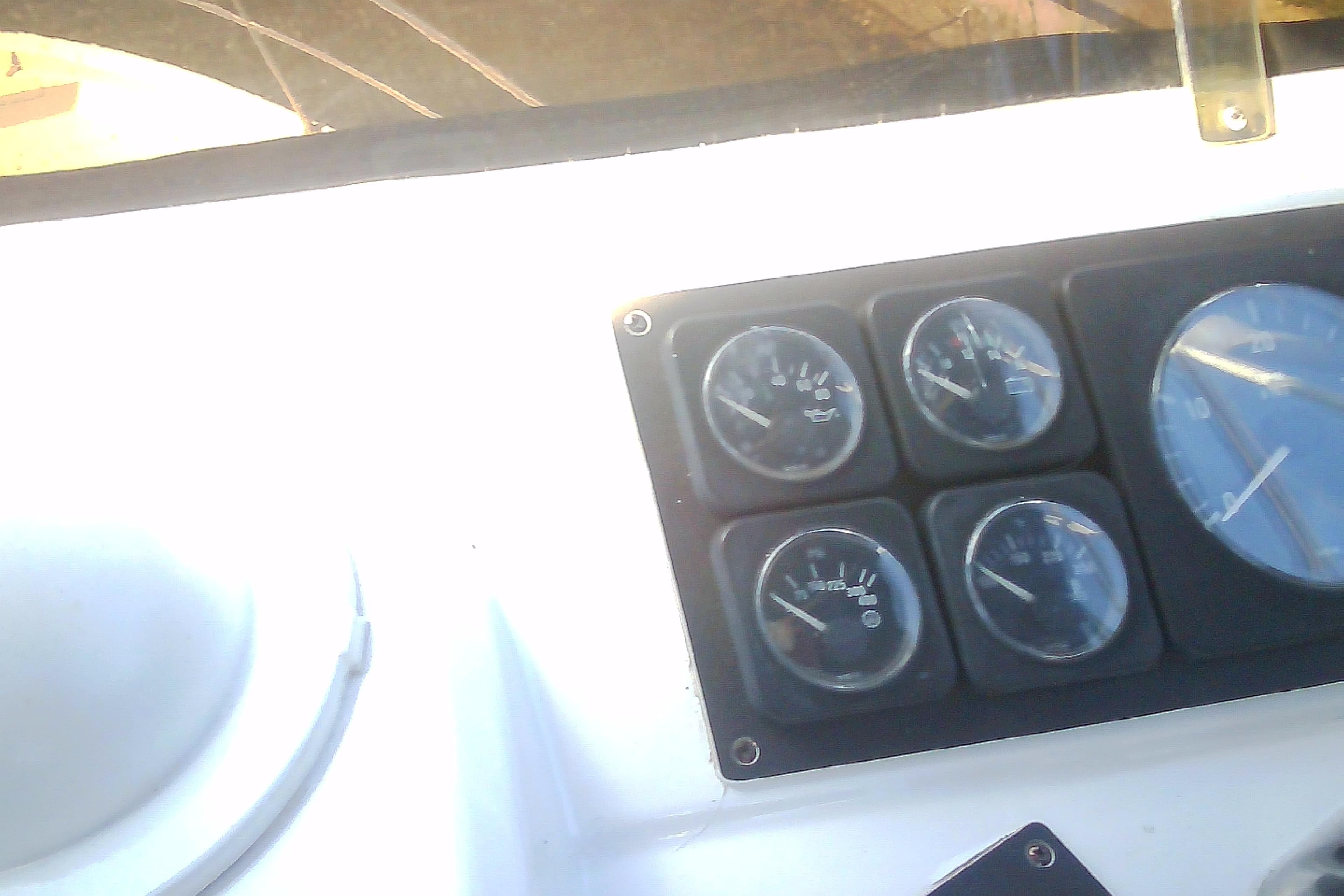 Dashboard gauges on a 1999 Sabre 34 boat, displaying various instrument readings.