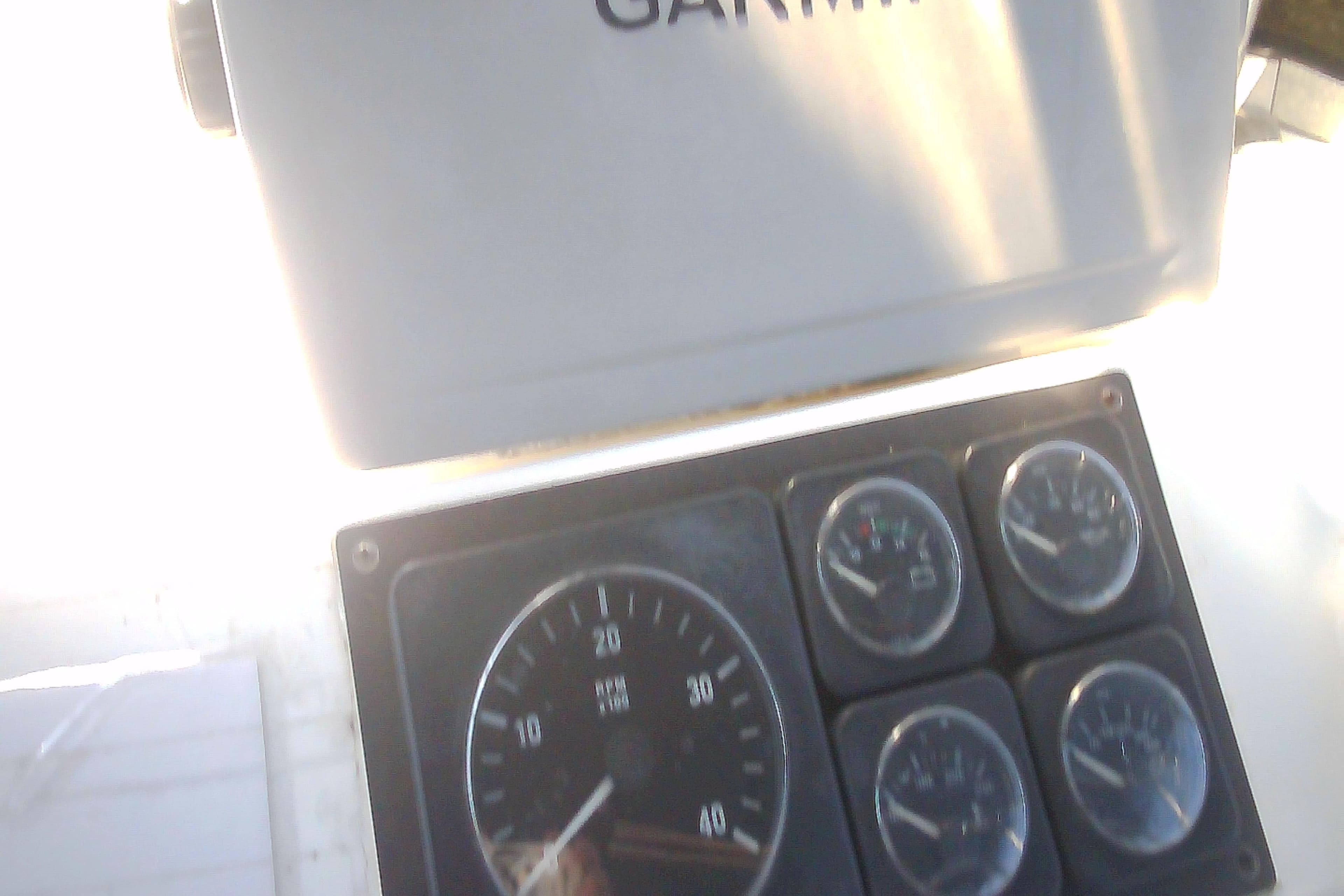 Dashboard of a 1999 Sabre 34 boat with Garmin navigation equipment.