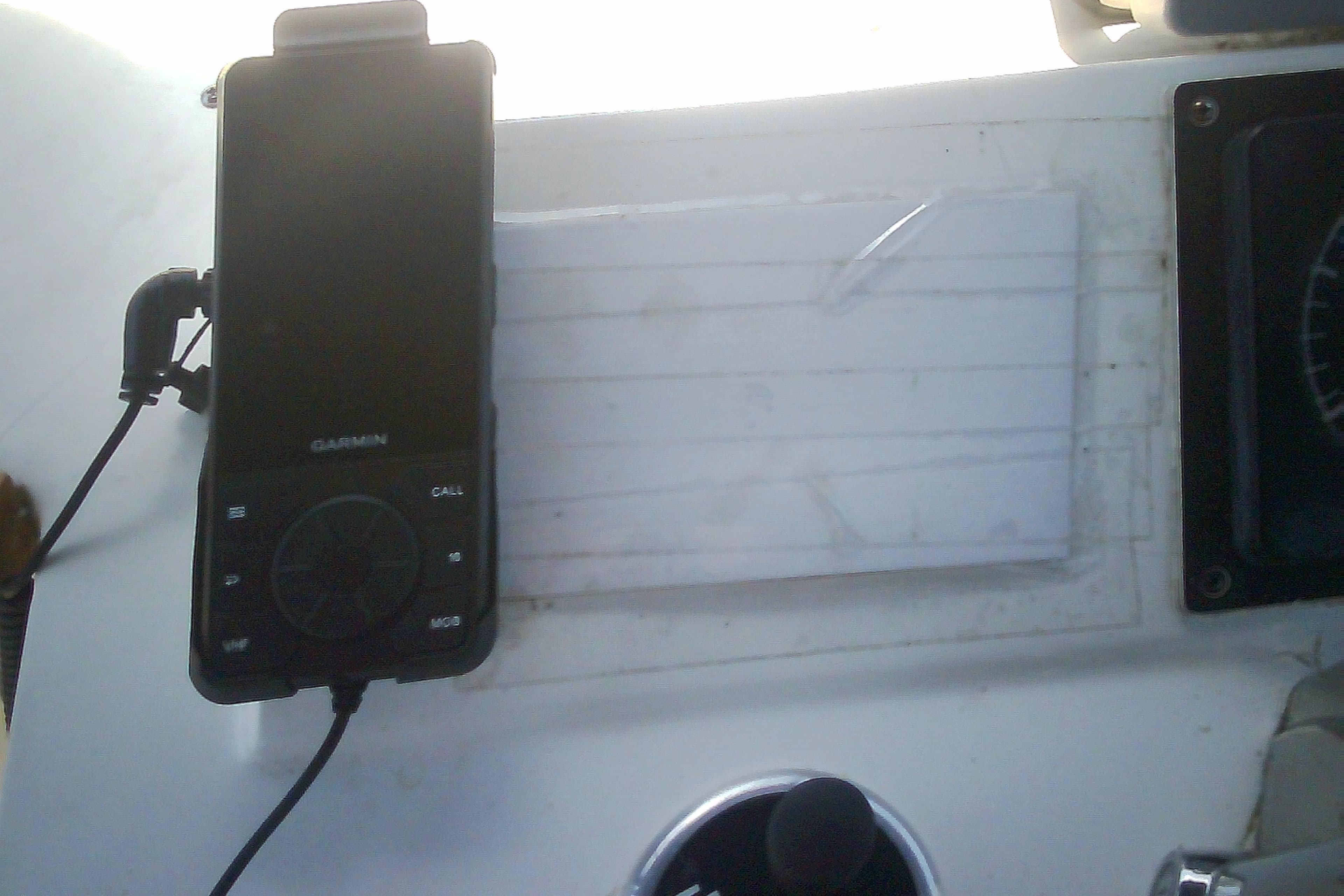Garmin device mounted on a 1999 Sabre 34 boat dashboard.