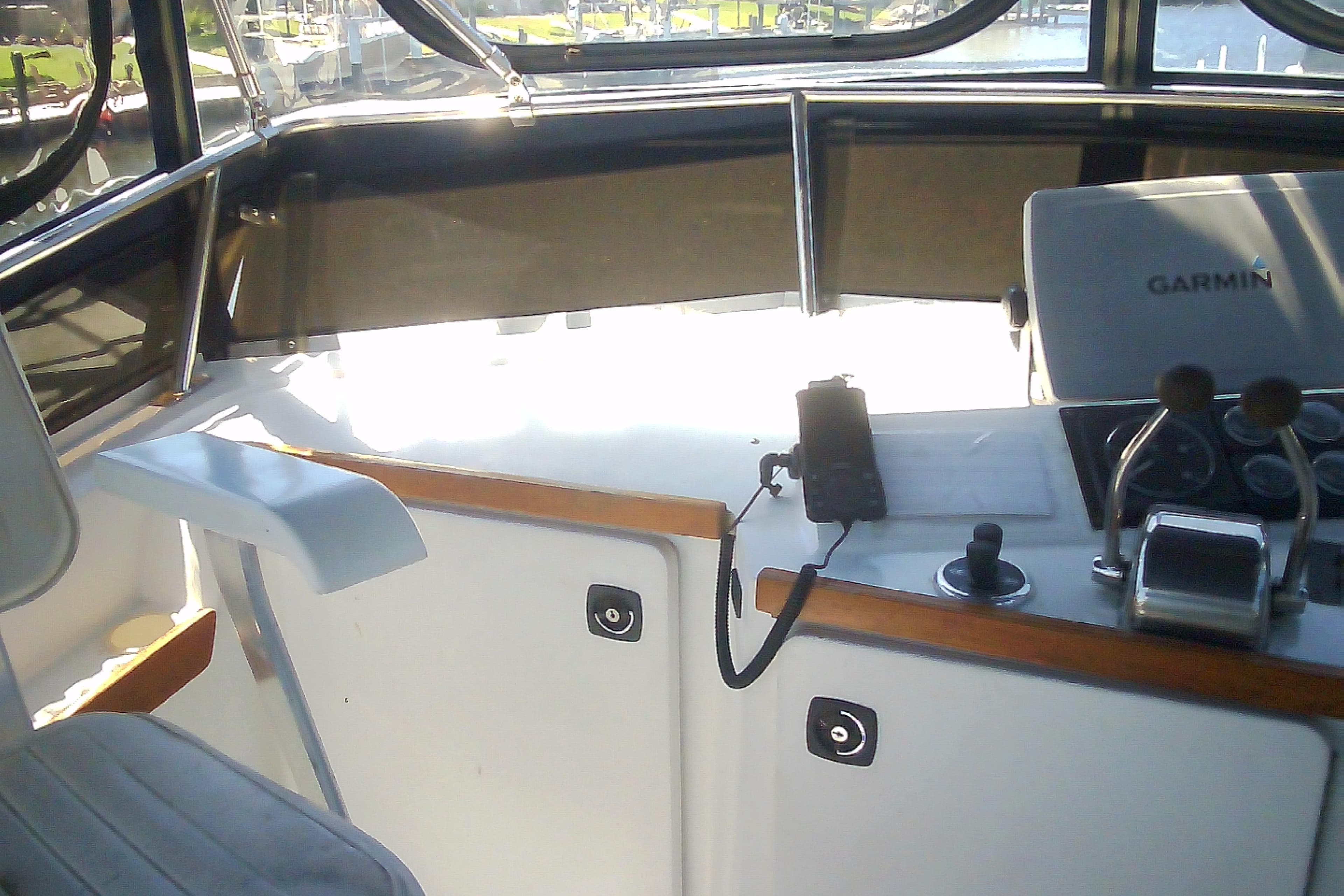 Interior view of a 1999 Sabre 34 boat cockpit with Garmin navigation system.