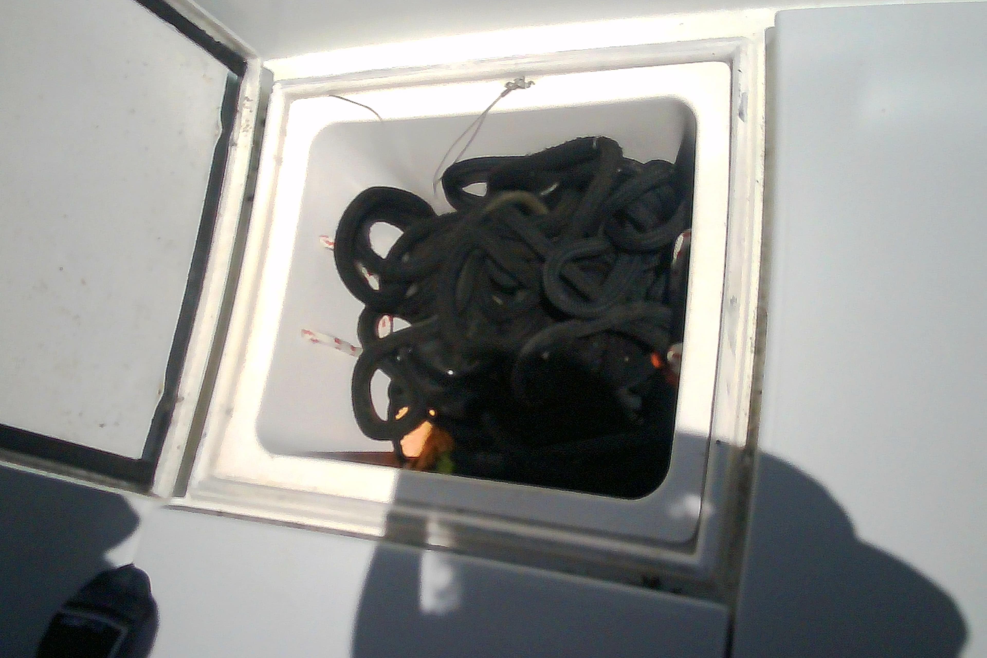 Boat storage compartment with coiled ropes, Sabre 34, 1999 model.