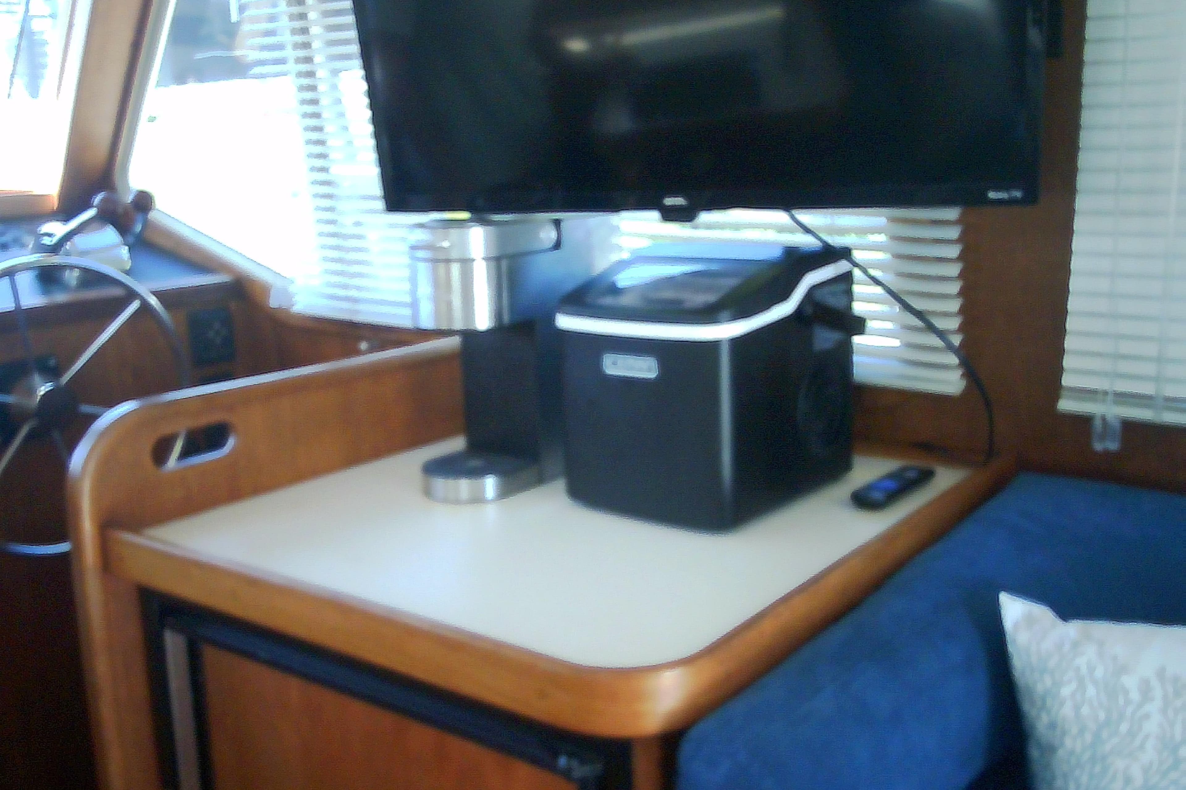 Interior of a 1999 Sabre 34 boat with TV and appliances.