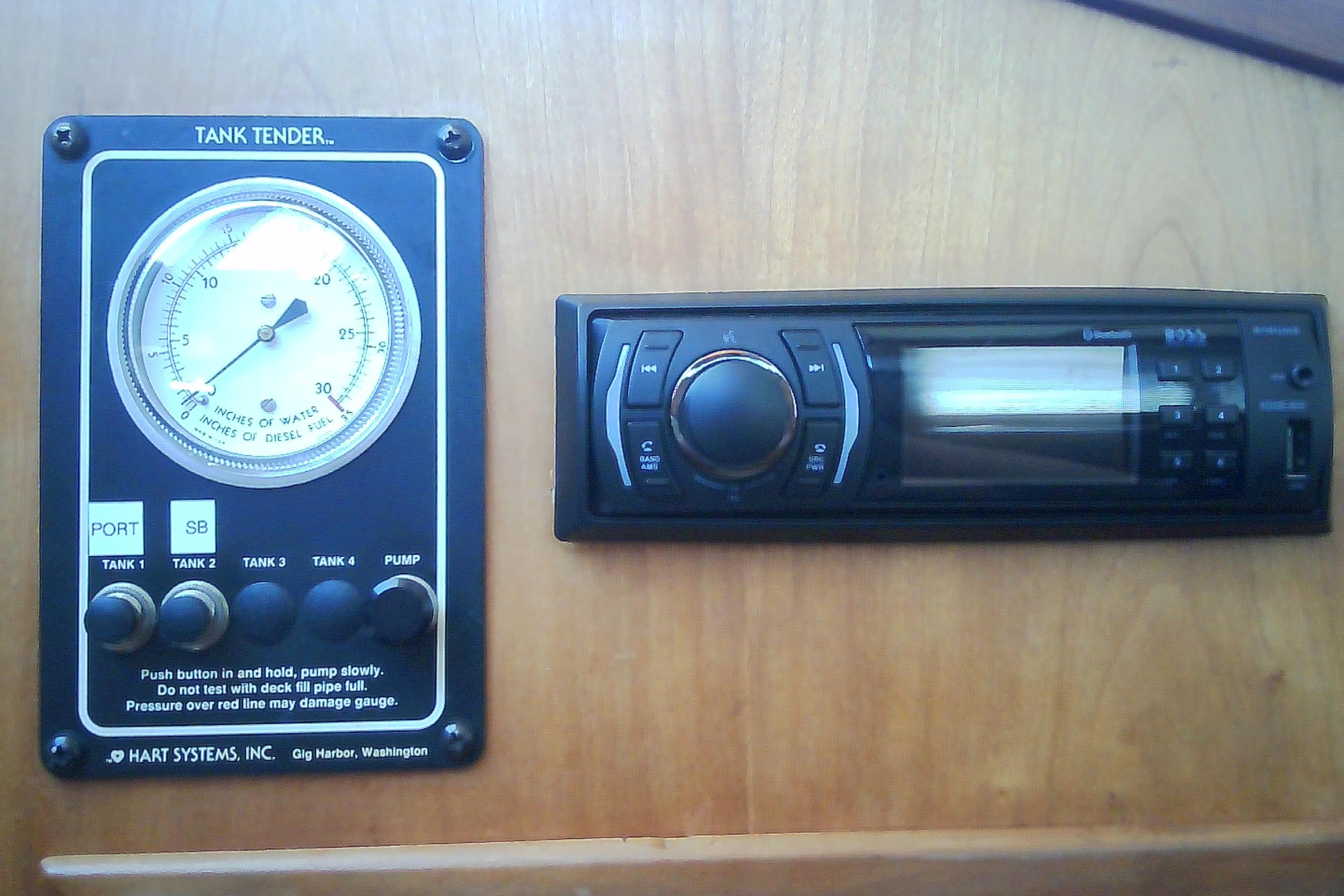 Tank tender gauge and stereo system on a 1999 Sabre 34 boat.