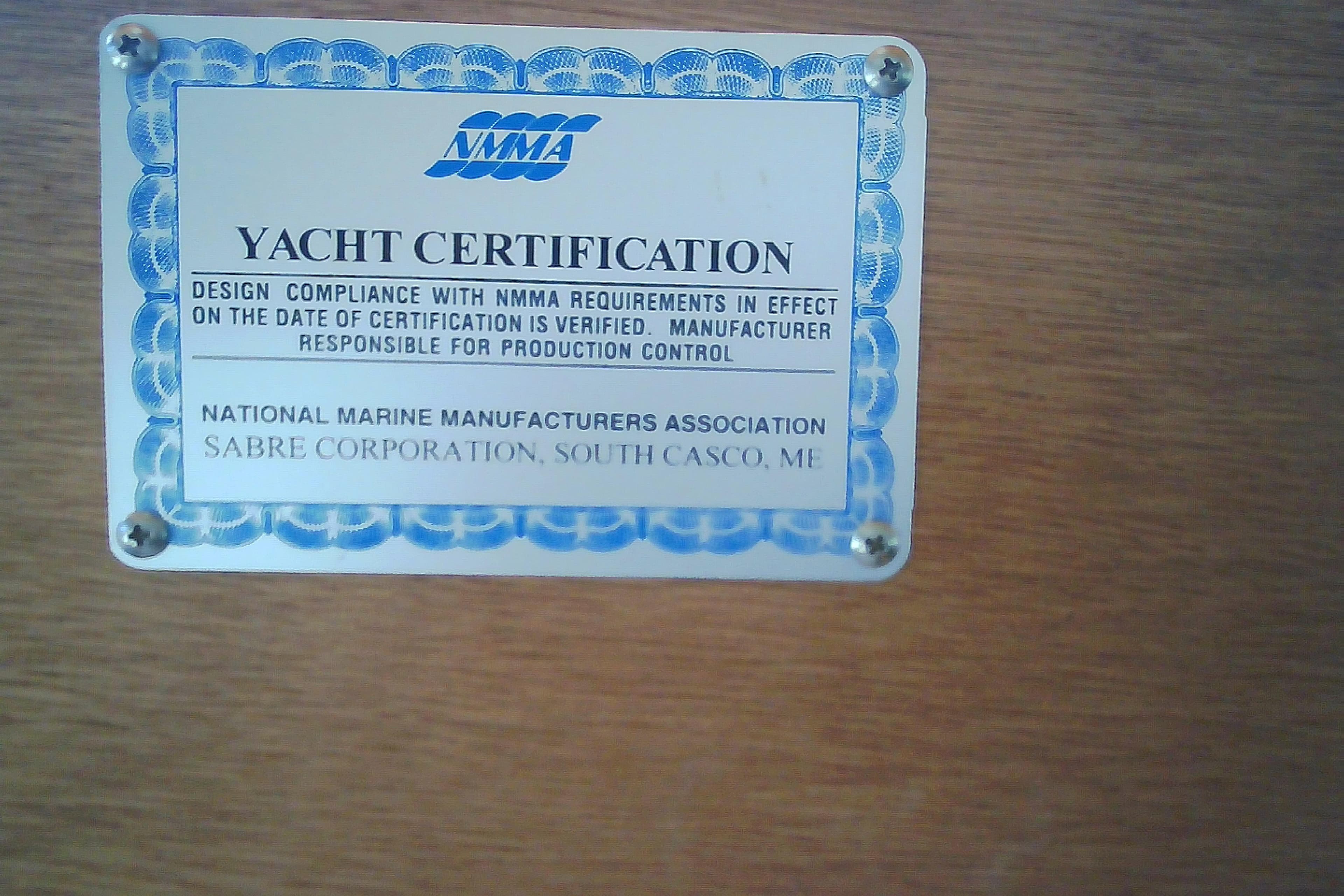 Yacht certification plaque for Sabre 34, 1999, by NMMA and Sabre Corporation.