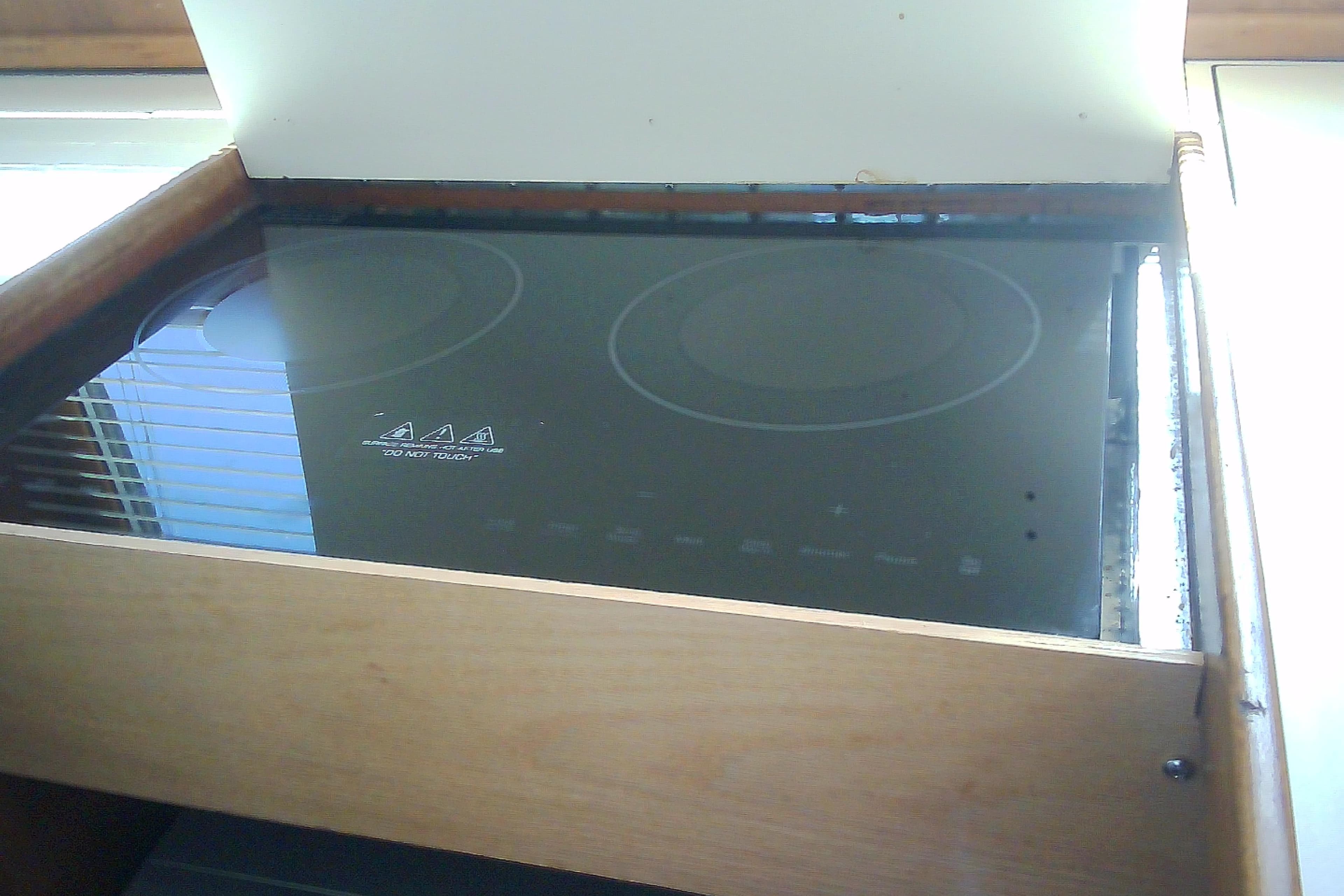 Built-in electric stove on a Sabre 34, 1999 model yacht kitchen.