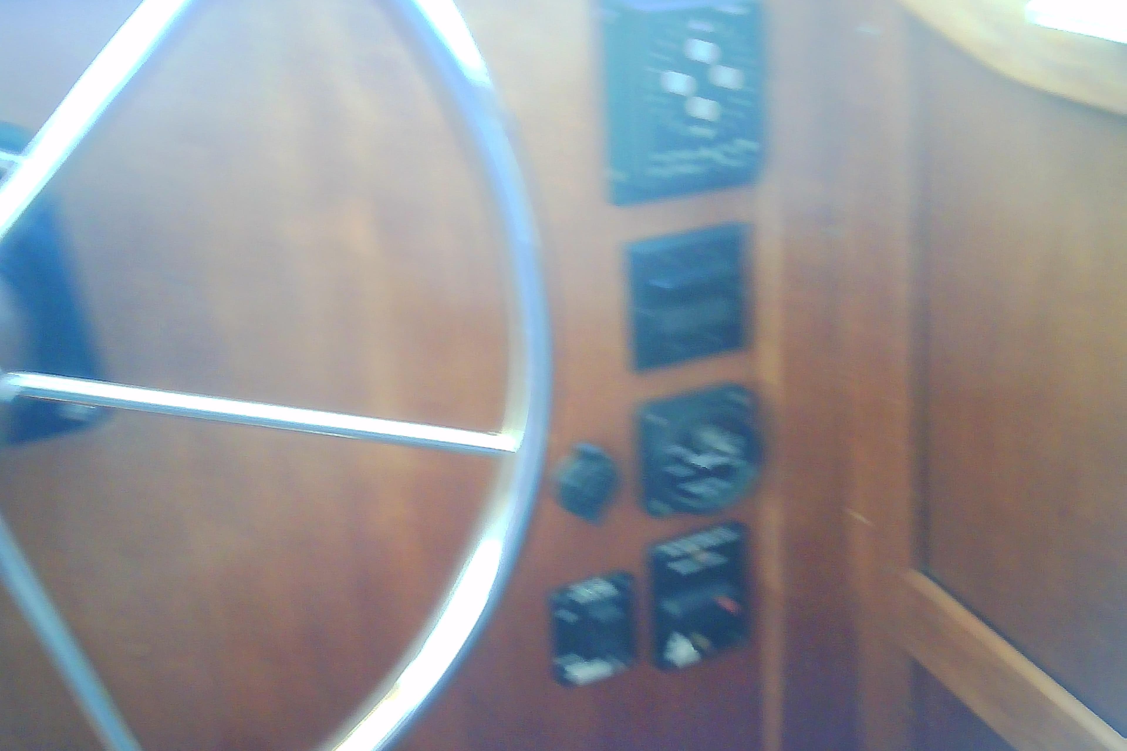 Steering wheel and control panel of a 1999 Sabre 34 boat.