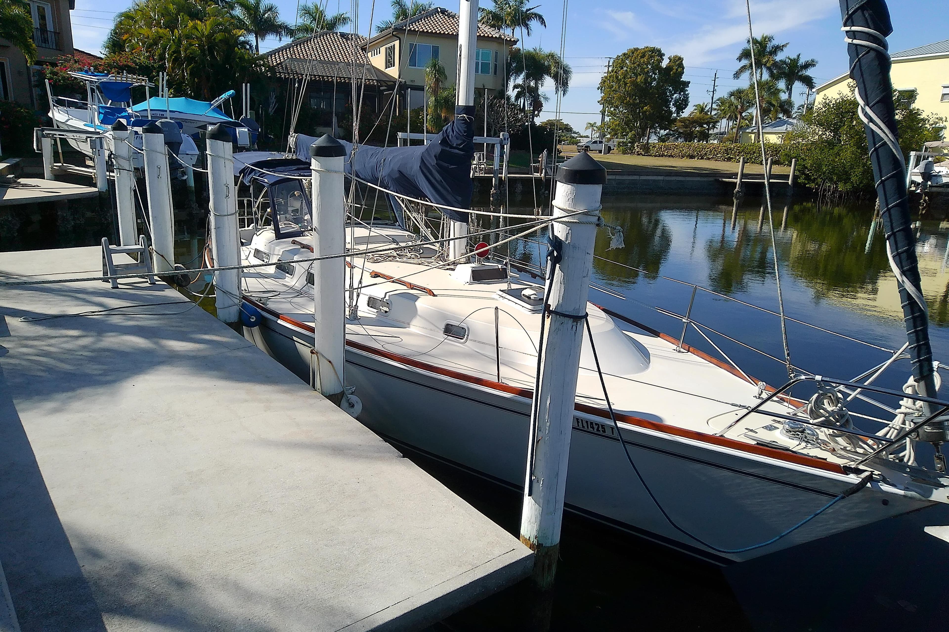 1988 Pearson 36-2 sailboat docked in a serene marina setting.