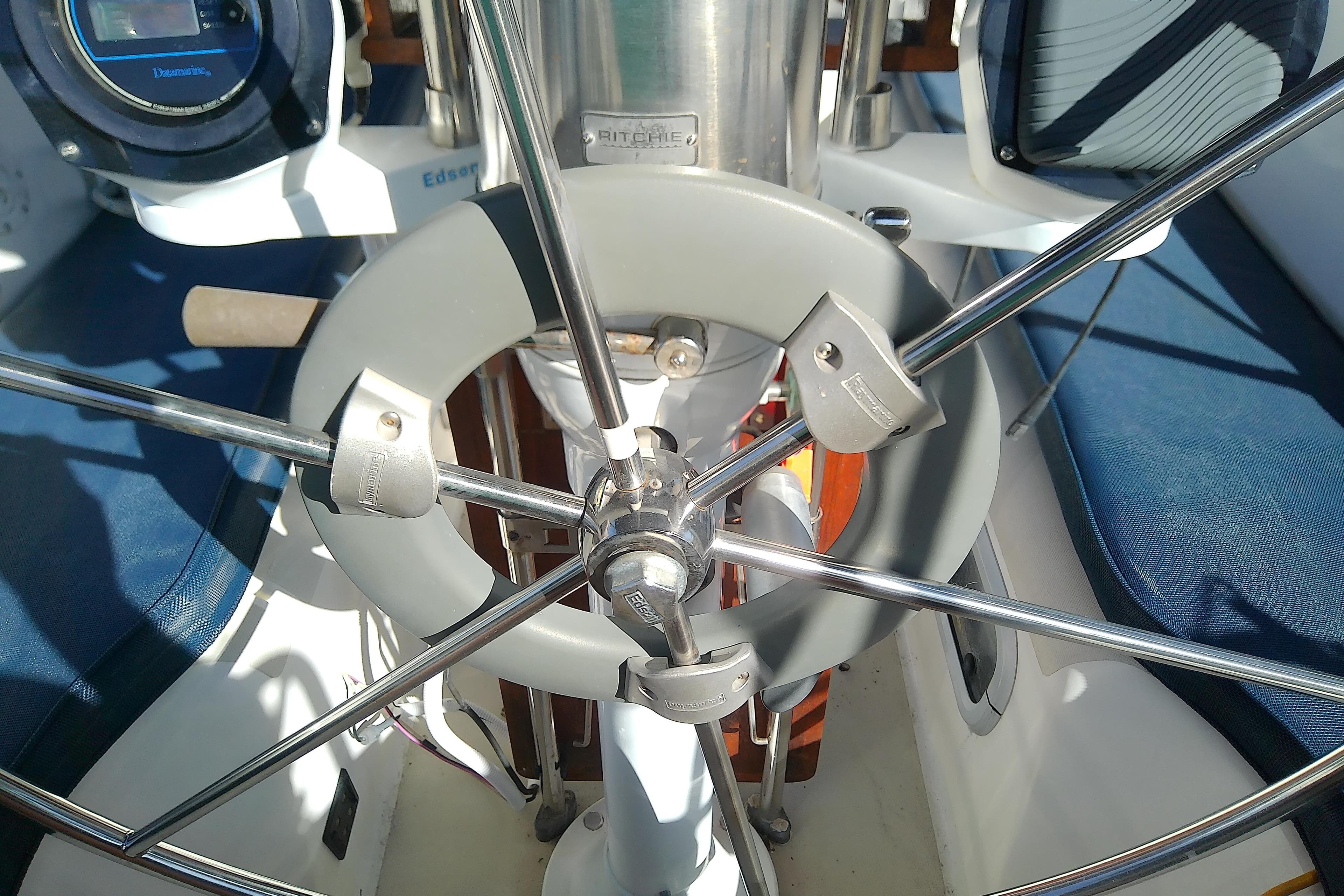 Steering wheel of a 1988 Pearson 36-2 sailboat with navigation instruments.