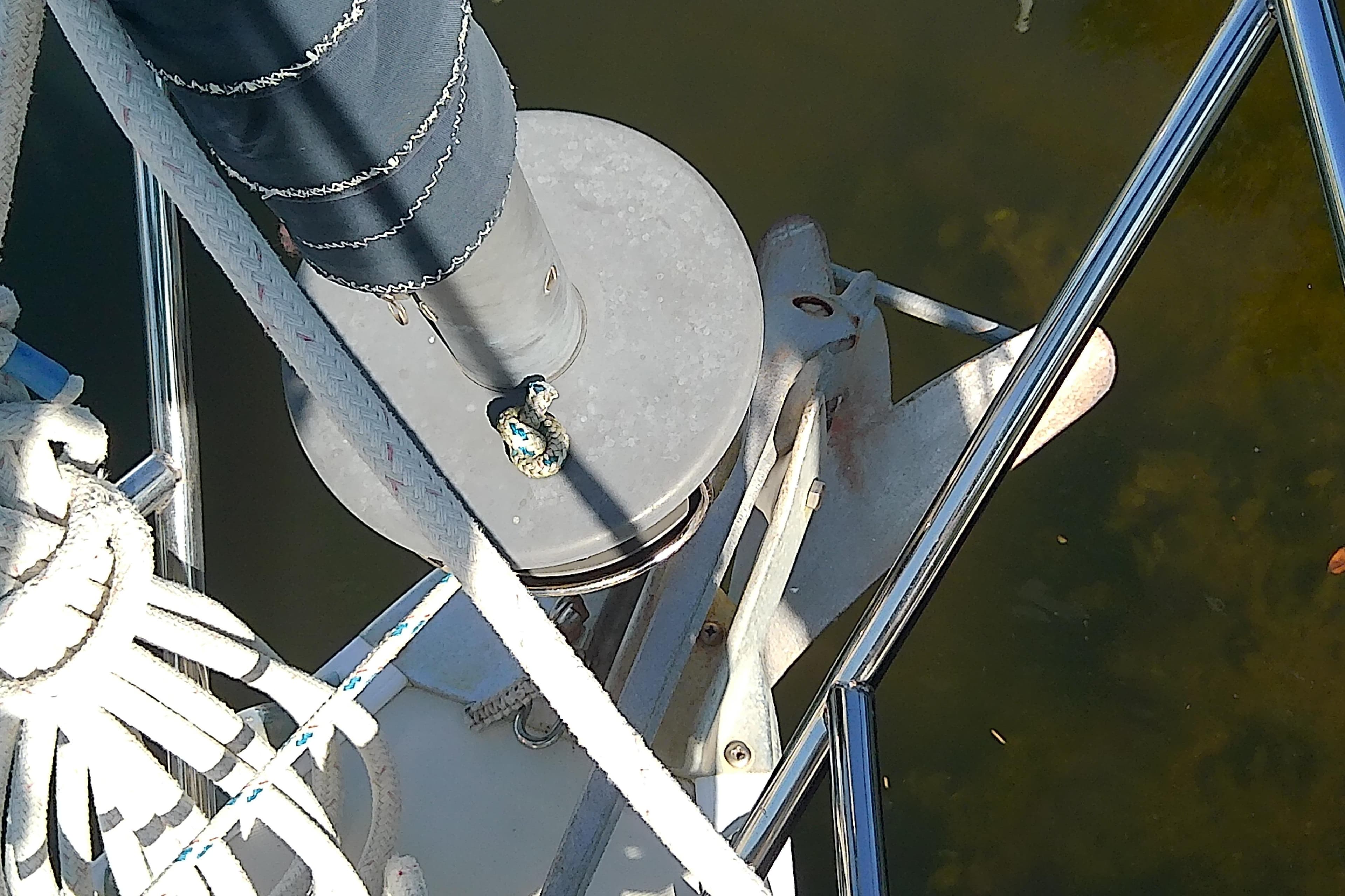 Close-up of 1988 Pearson 36-2 sailboat deck with anchor and rigging.