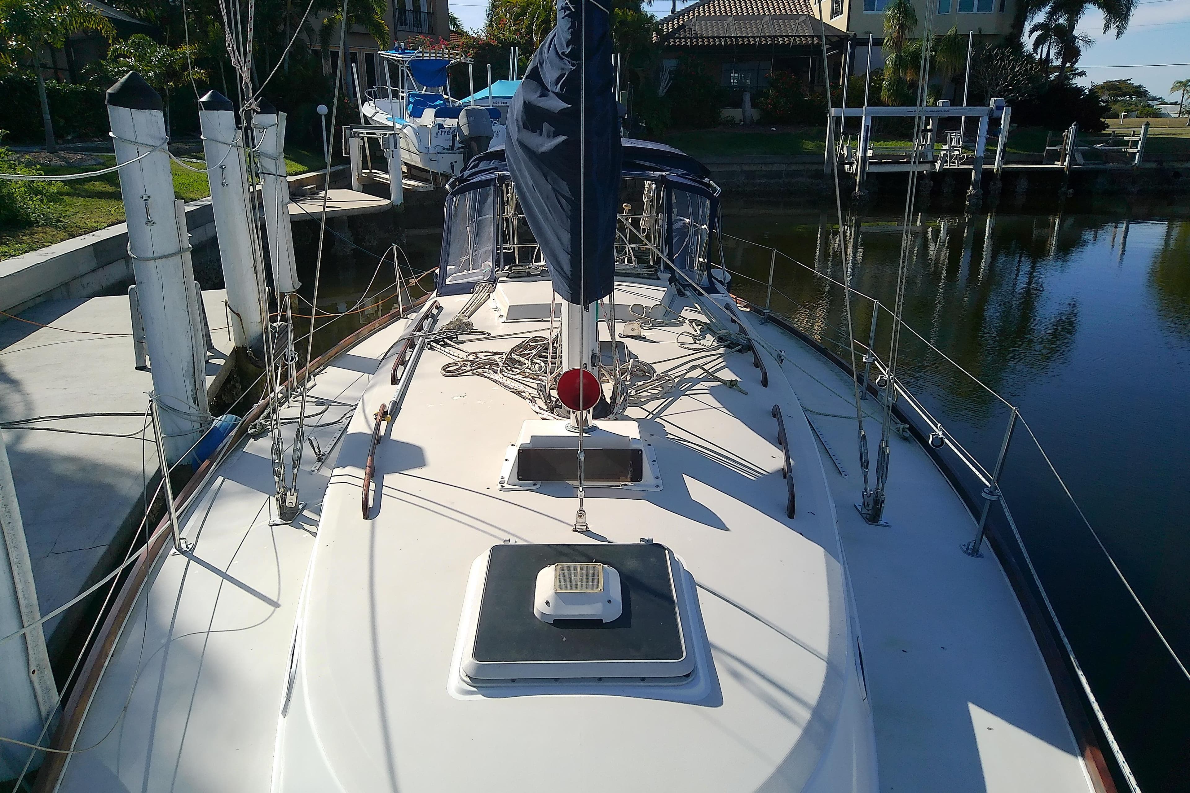 1988 Pearson 36-2 sailboat docked in a serene marina setting.