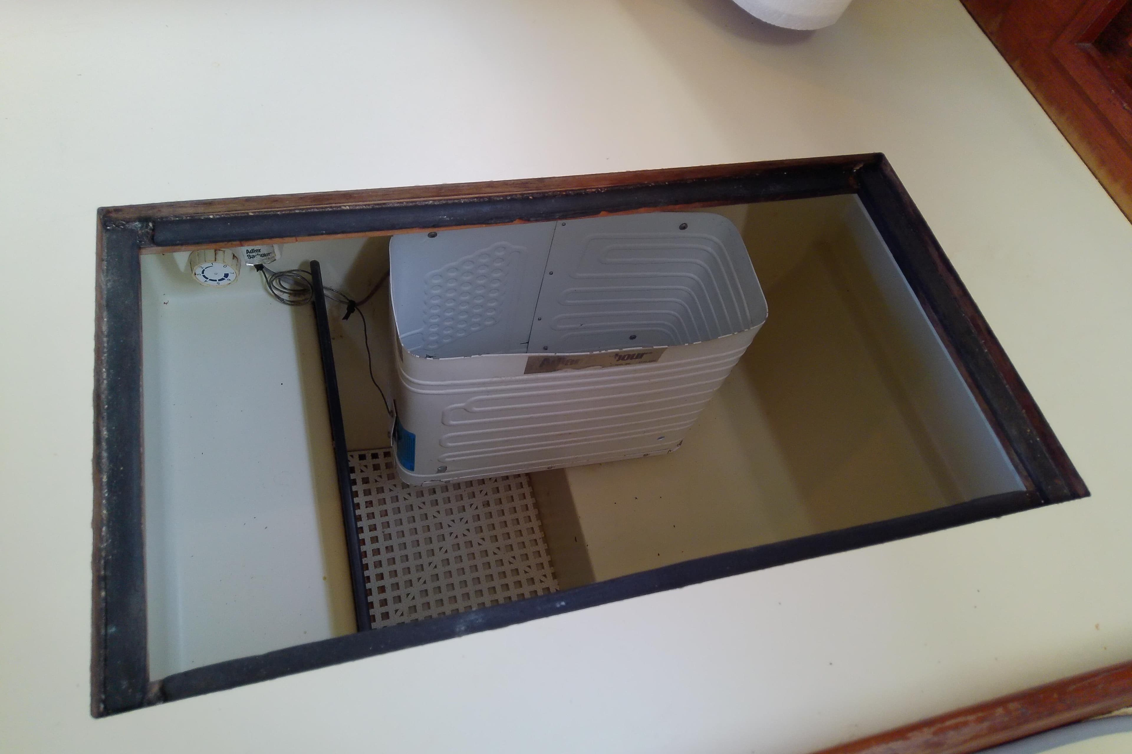 Open compartment in 1988 Pearson 36-2 boat interior, showing storage space.