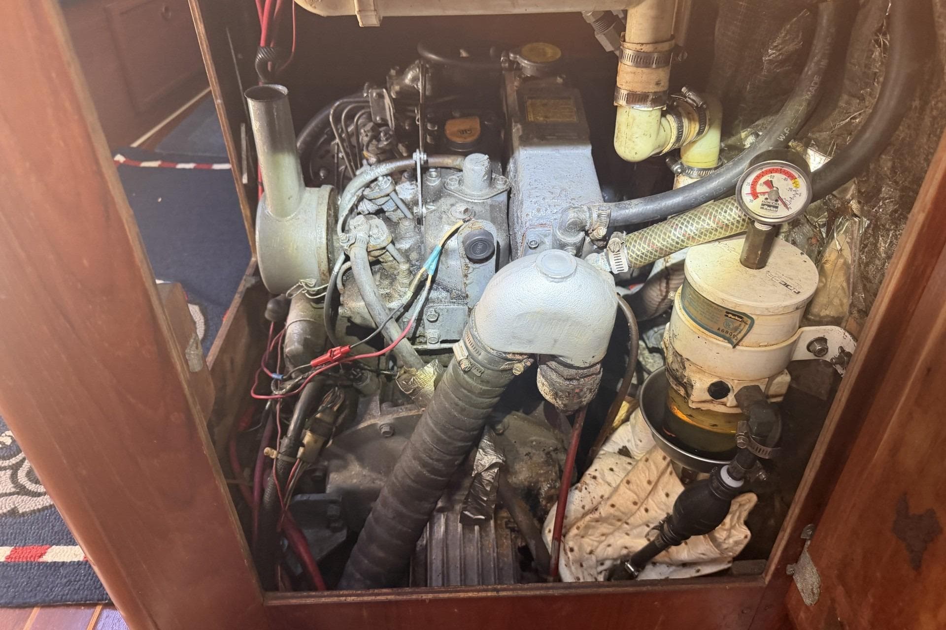 Engine compartment of a 1988 Pearson 36-2 sailboat, showing detailed mechanical components.