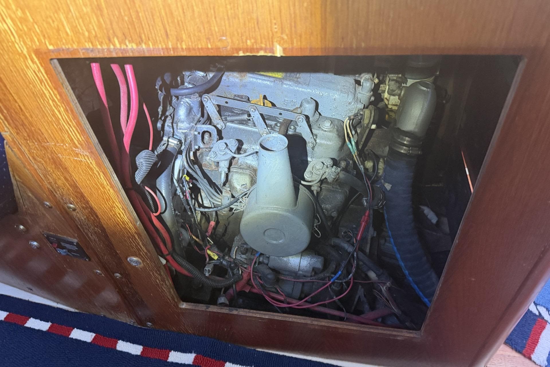 Engine compartment of a 1988 Pearson 36-2 sailboat, showing wiring and components.