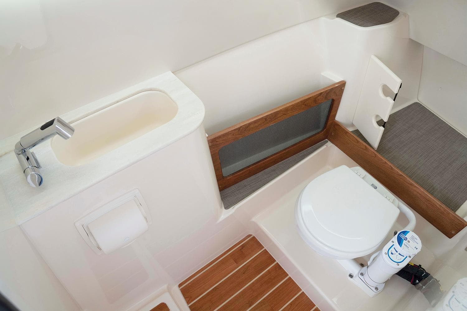 Manufacturer Provided Image: 2023 Grady-White Freedom 285 boat bathroom with sink and toilet.