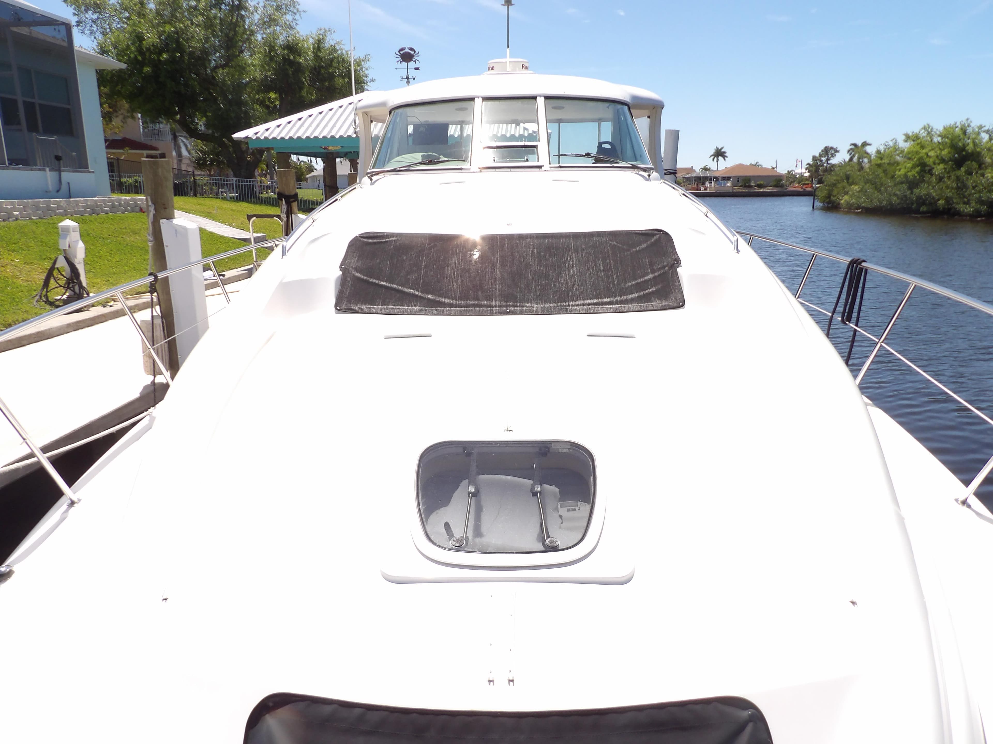 2003 Sea Ray 390 Motor Yacht docked at a marina.
