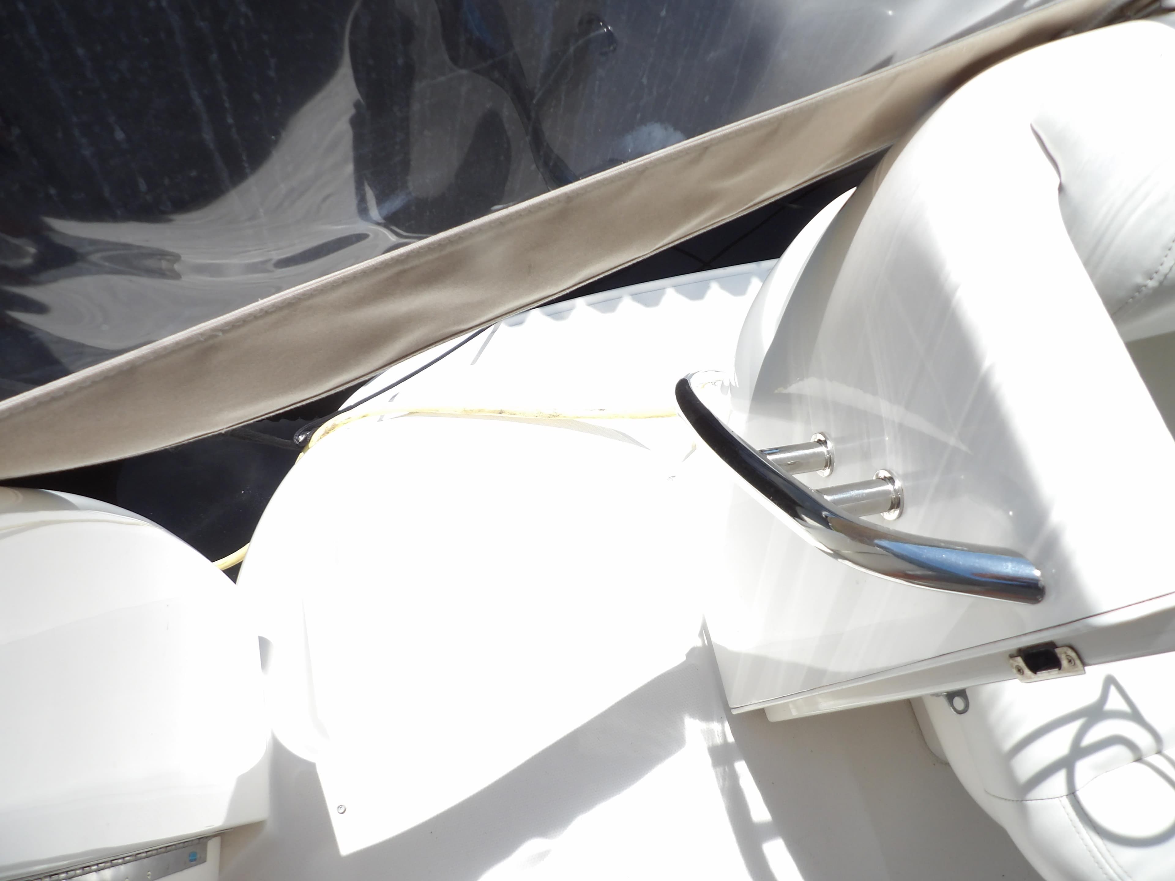 Interior seating of 2003 Sea Ray 390 Motor Yacht with white upholstery.