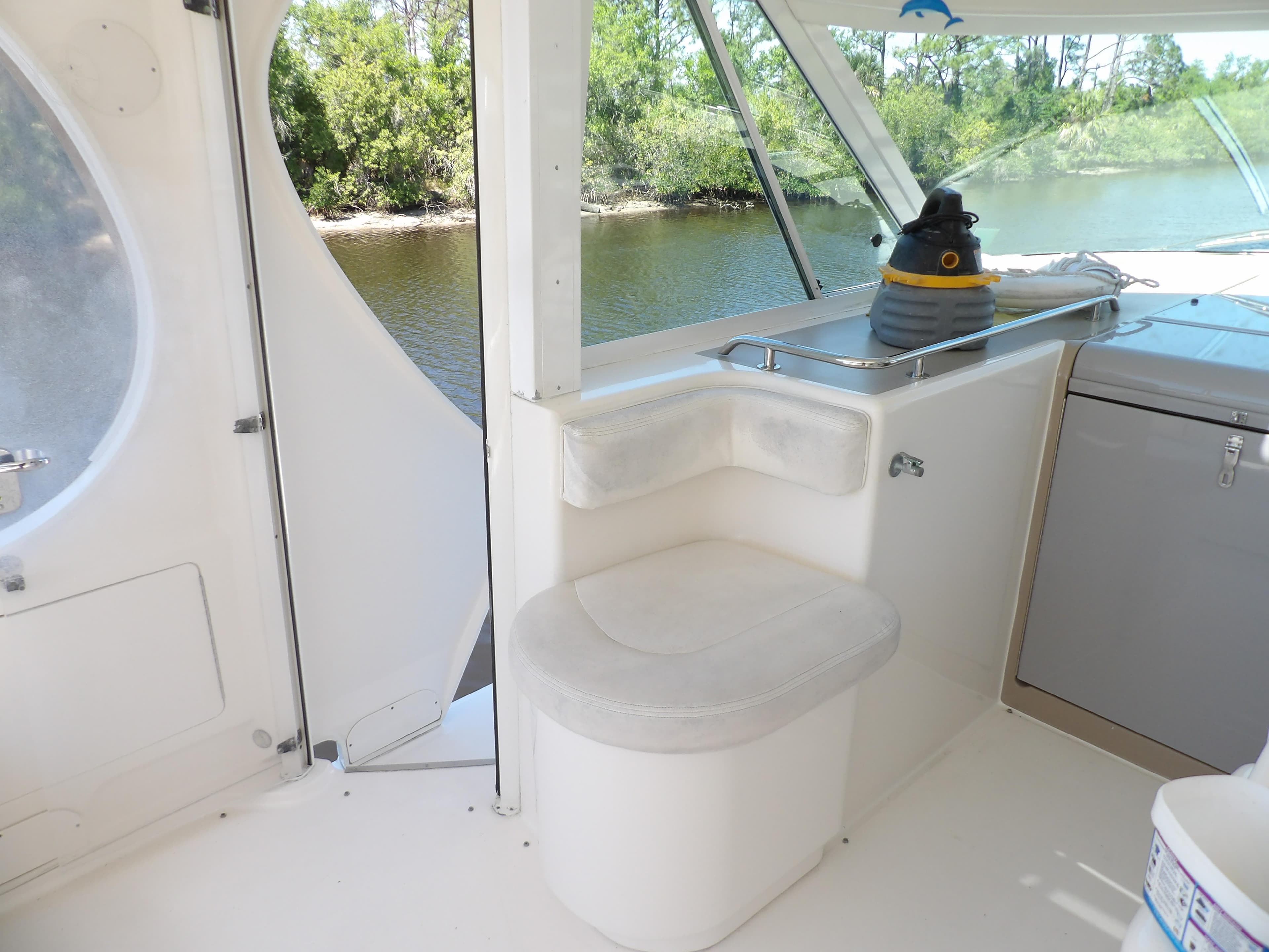 2003 Sea Ray 390 Motor Yacht interior with seating and water view.