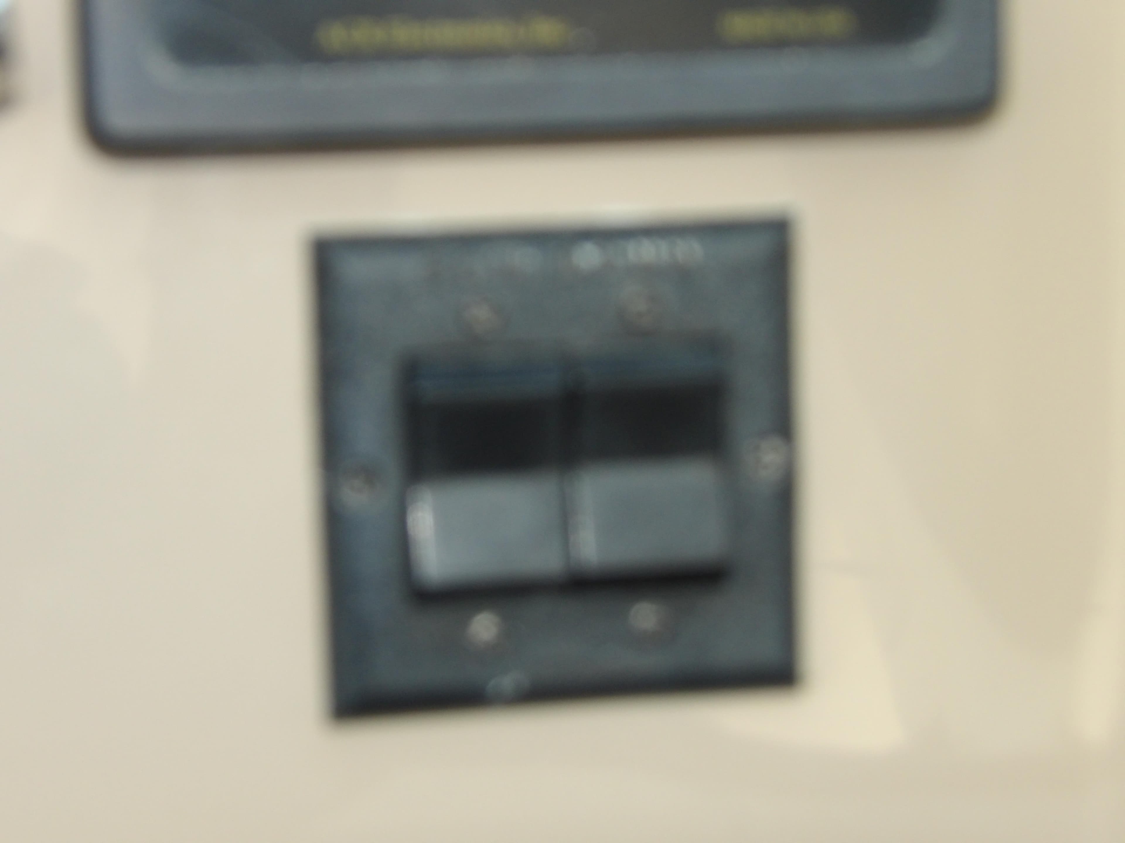 Close-up of a control switch on a 2003 Sea Ray 390 Motor Yacht.