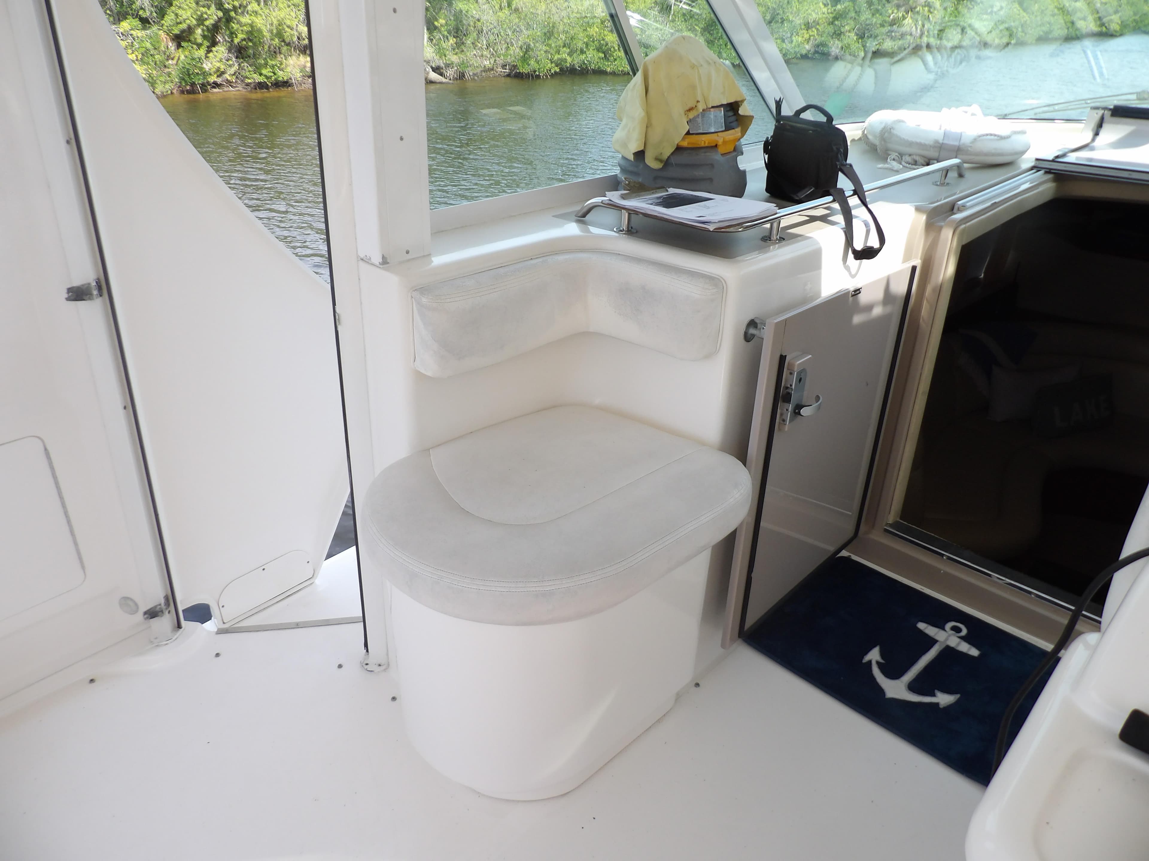 2003 Sea Ray 390 Motor Yacht interior with seating and kitchenette area.