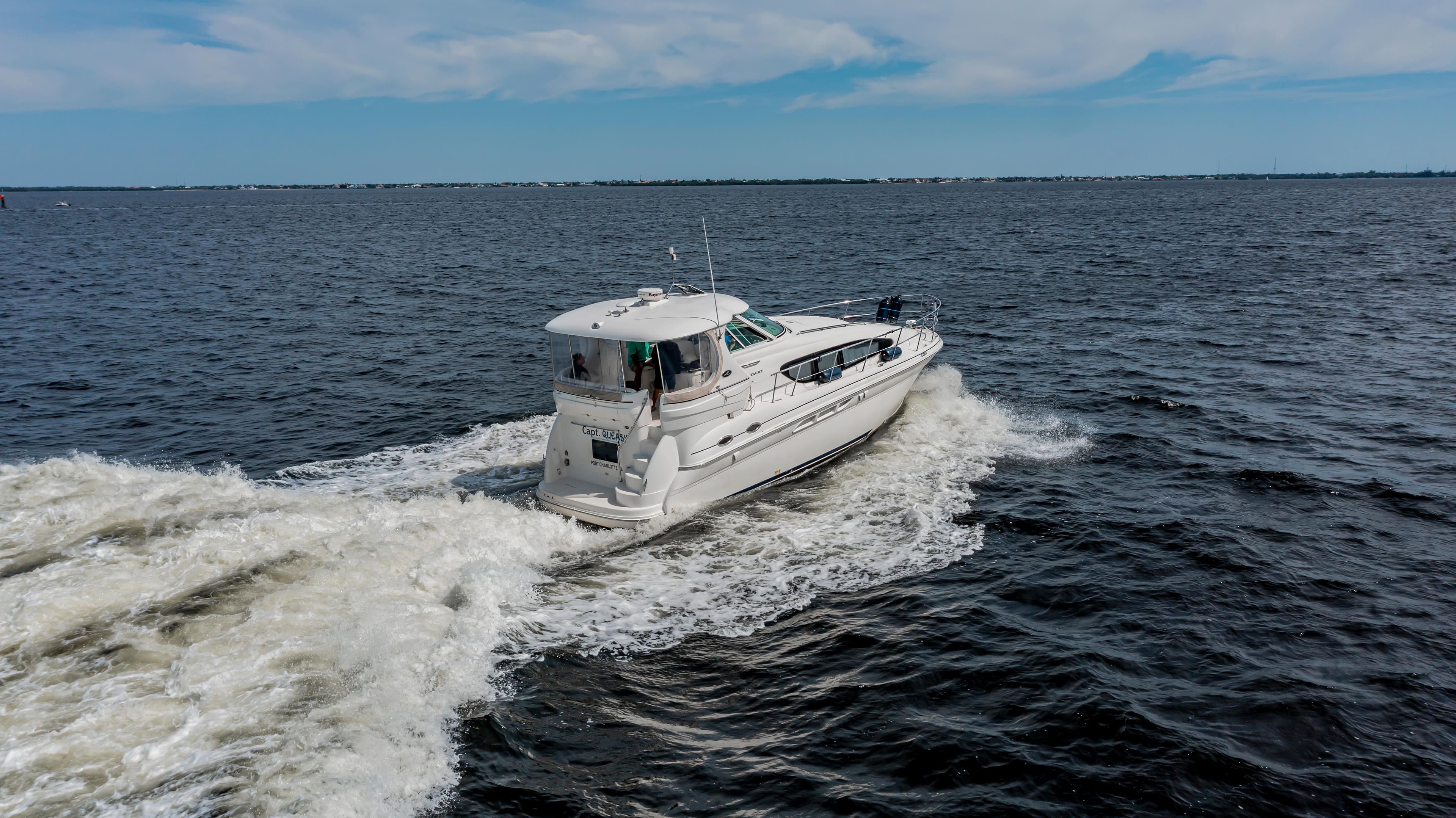 2003 Sea Ray 390 Motor Yacht cruising on open water.
