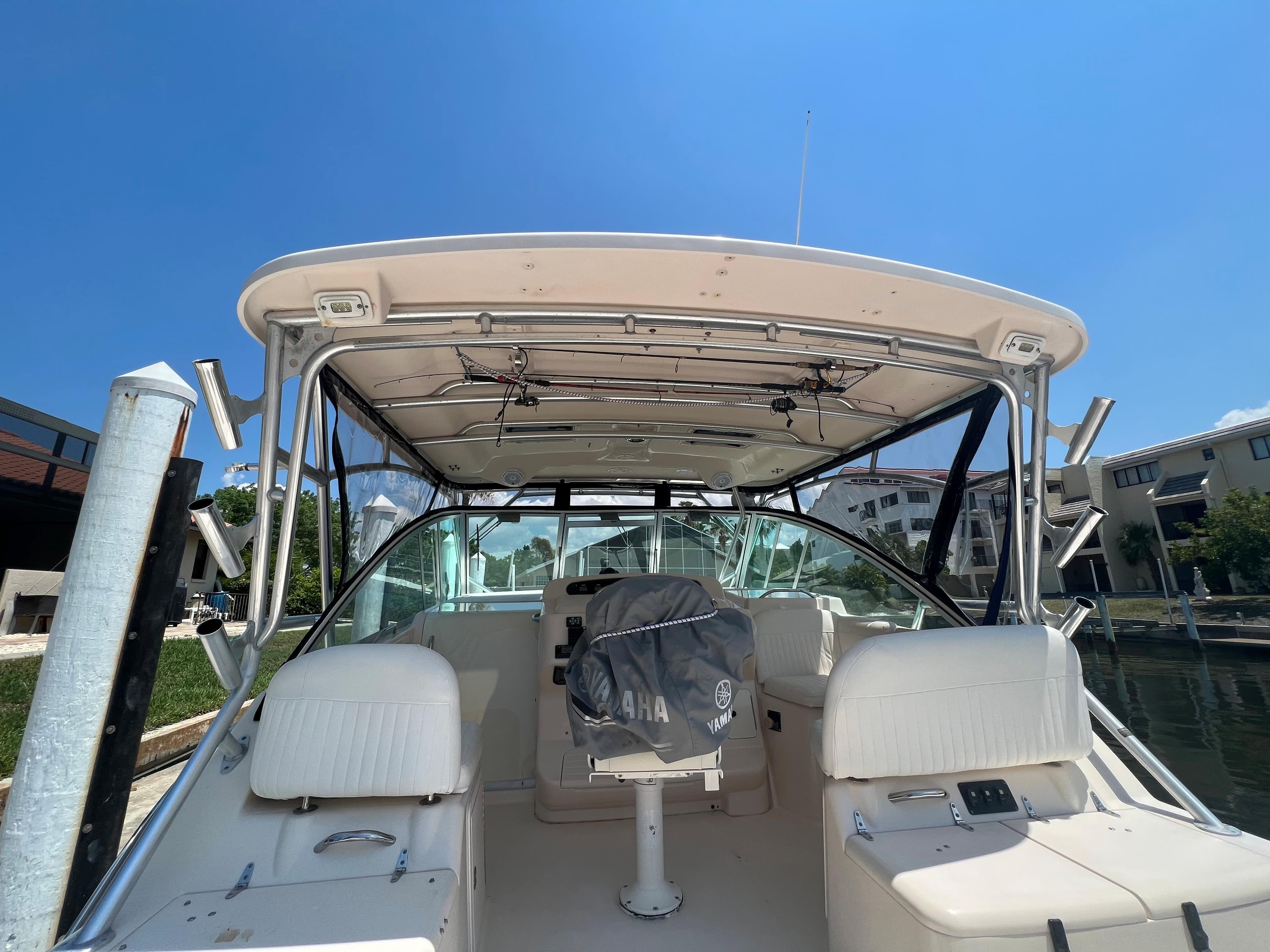 2006 Grady-White 360 Express boat interior with seating, docked under clear blue sky.