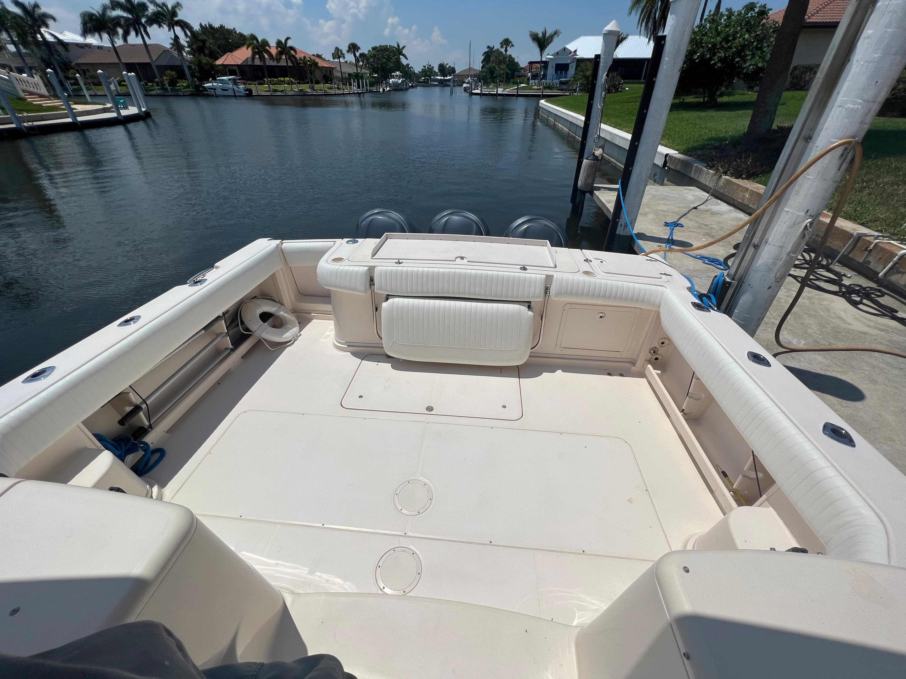2006 Grady-White 360 Express boat docked in a scenic canal setting.