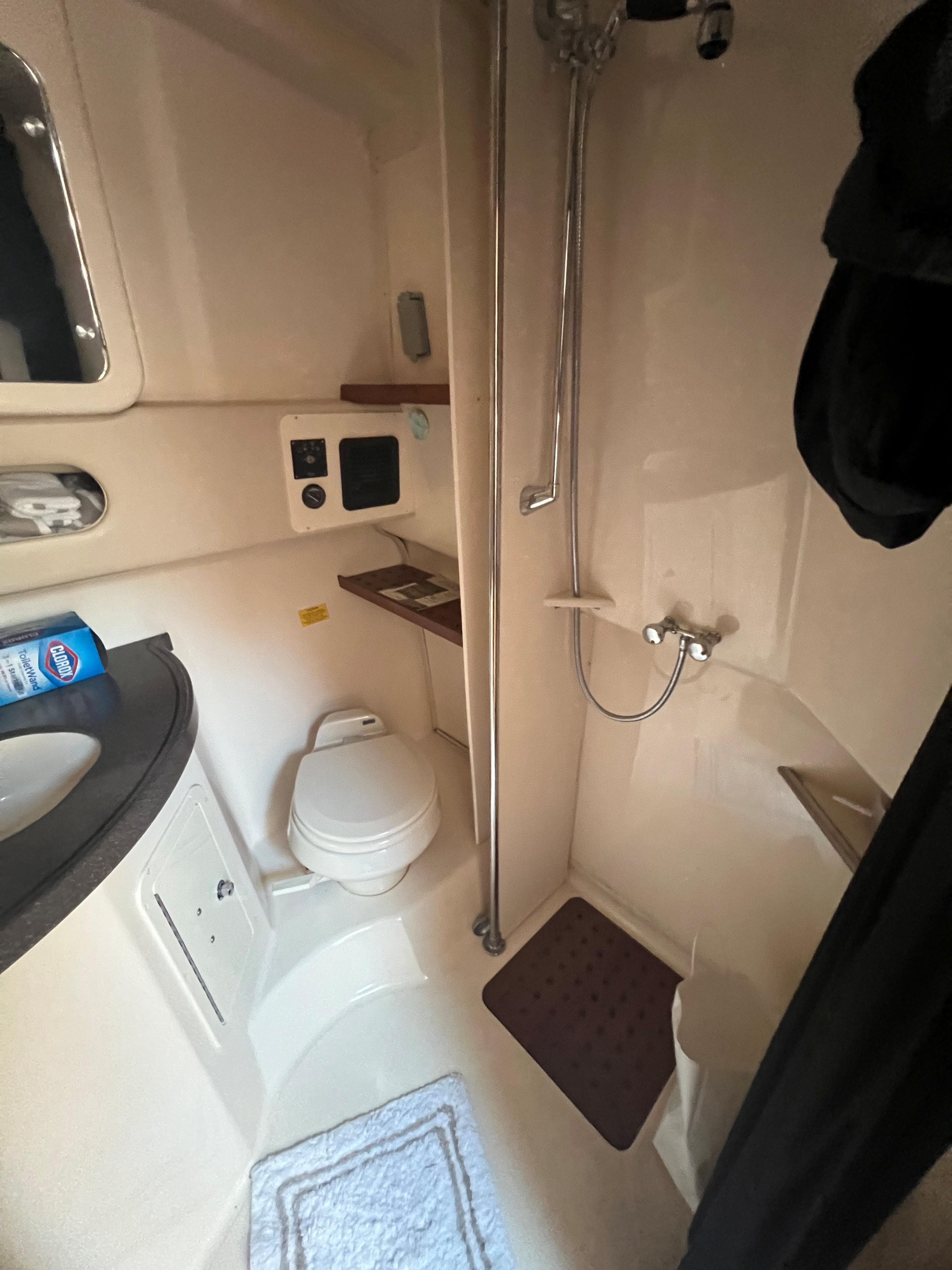 Bathroom interior of 2006 Grady-White 360 Express boat, featuring shower and toilet.