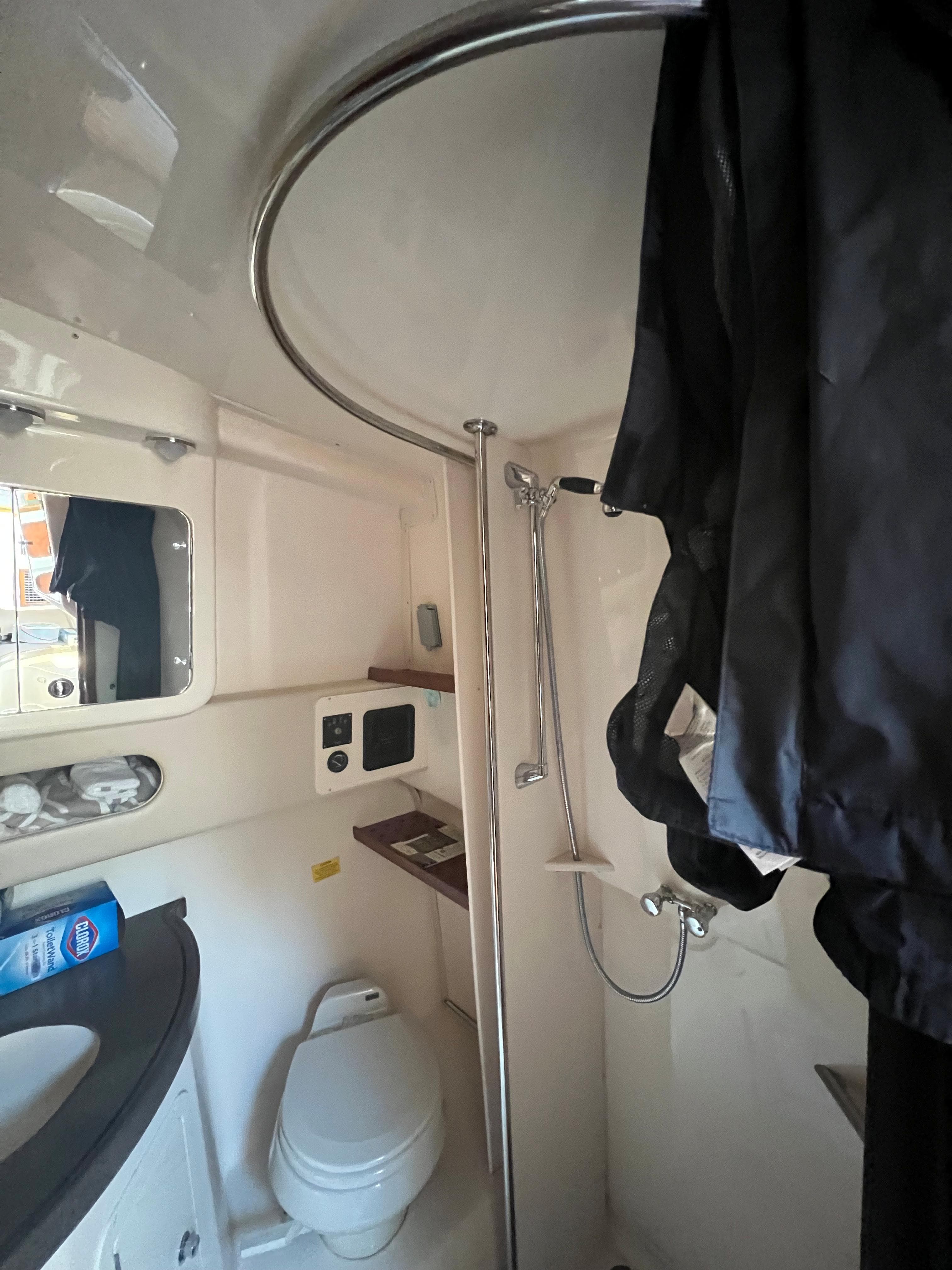 2006 Grady-White 360 Express boat bathroom with shower and toilet.