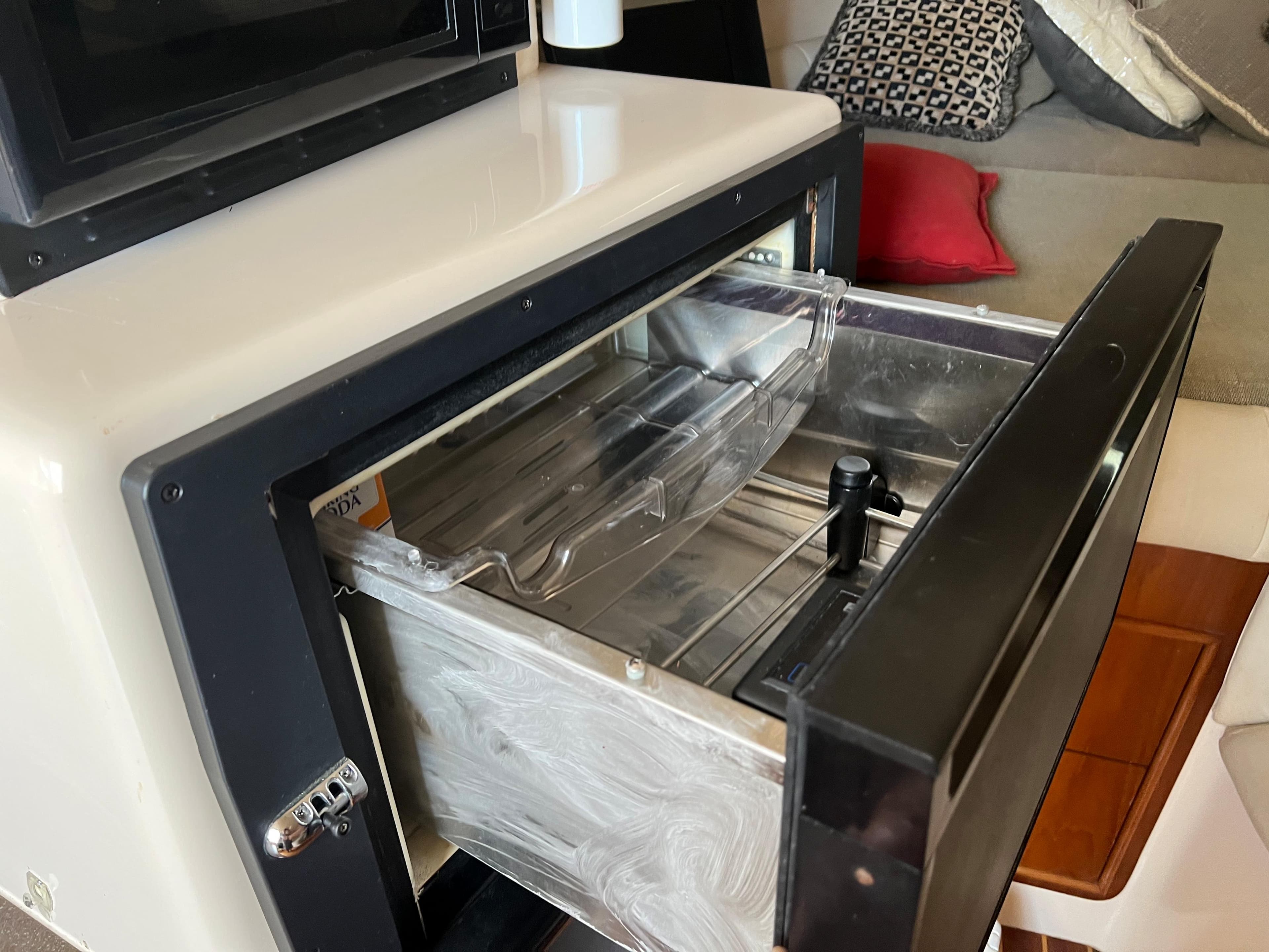 Open drawer in 2006 Grady-White 360 Express boat interior, showcasing storage space.